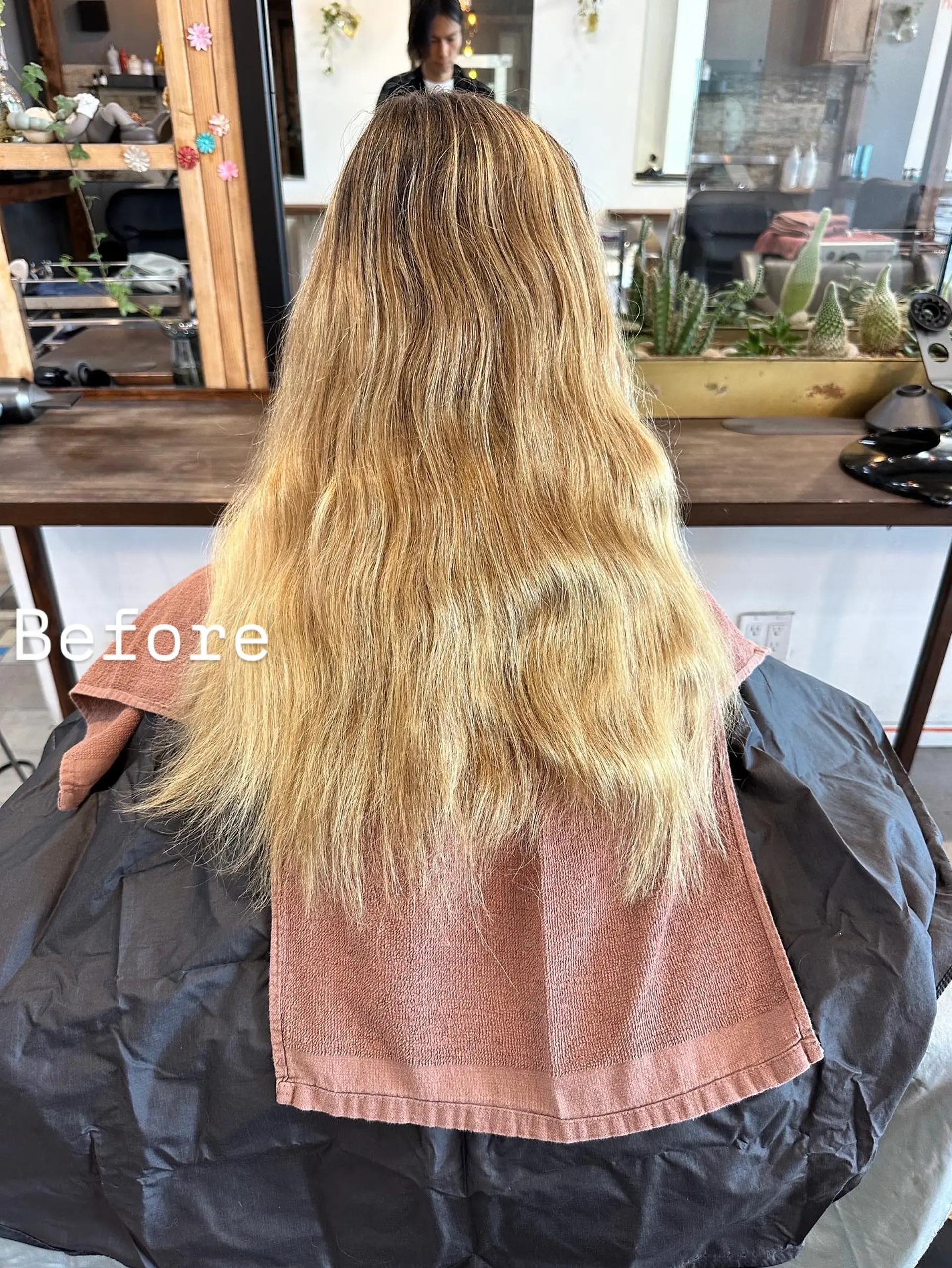 Long, layered hairstyle with face-framing layers. 2