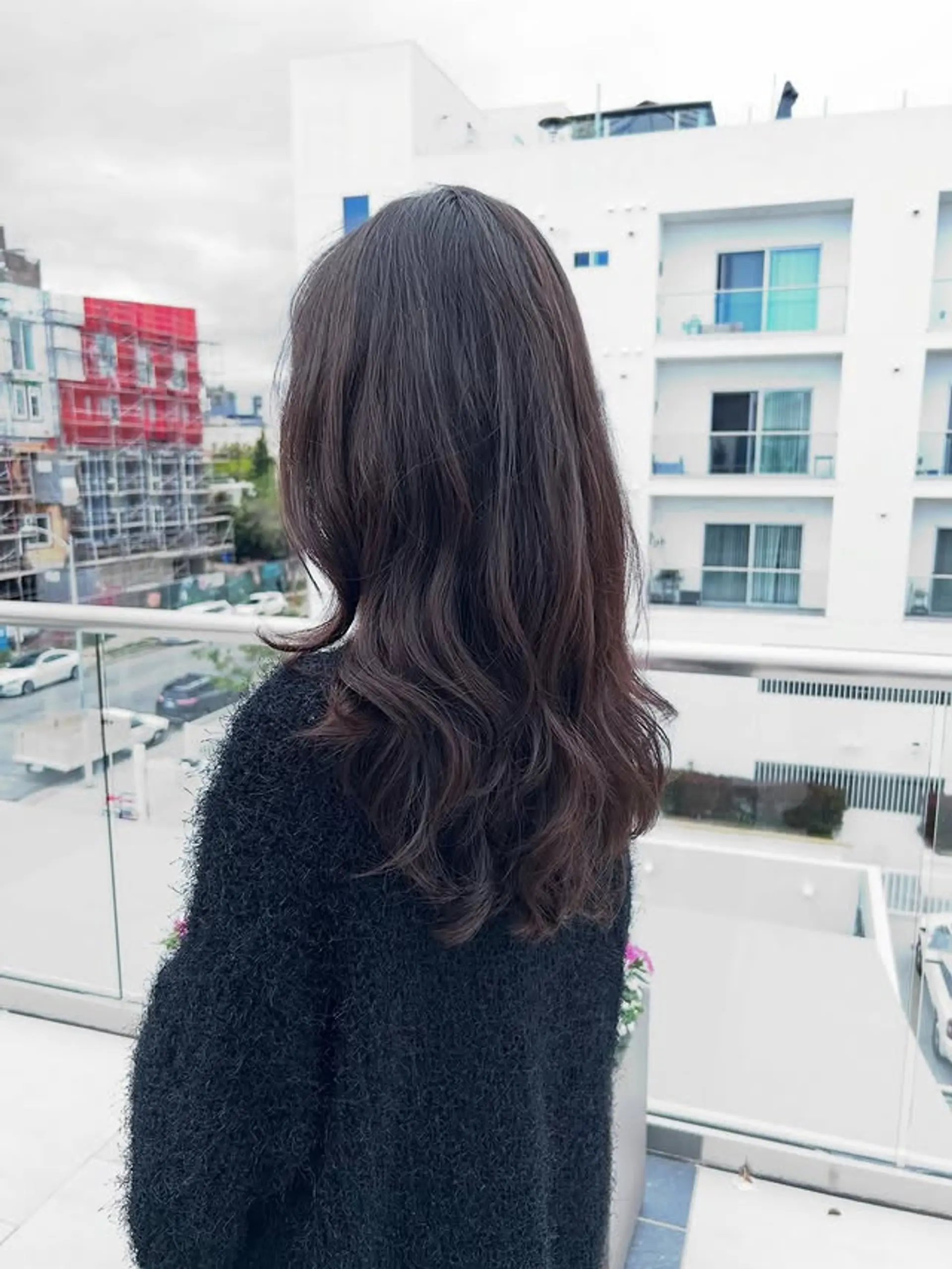 Long, soft waves with subtle layers create an effortlessly chic style. 1