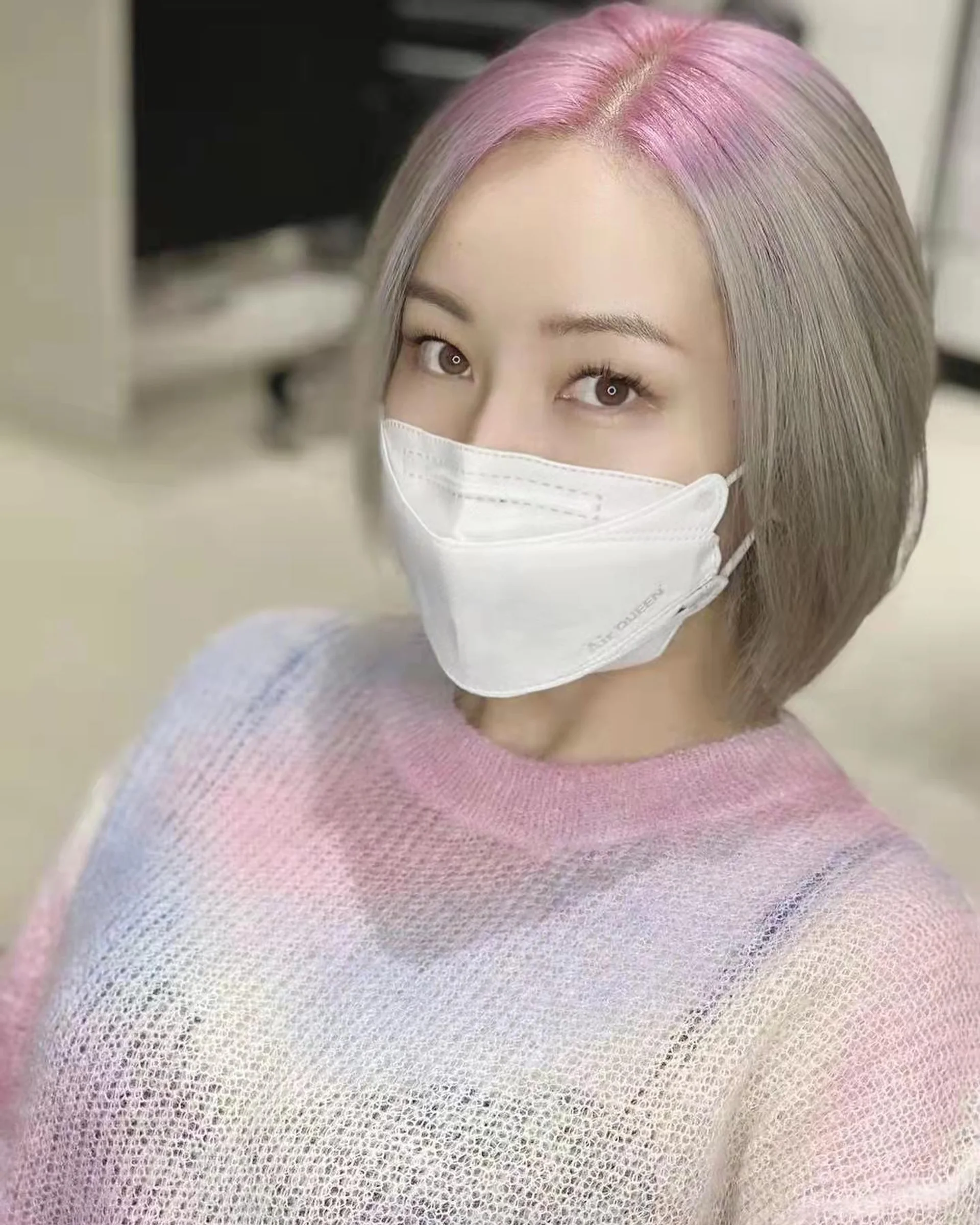 A woman with a chic shoulder-length lob haircut in a sophisticated smoky lavender shade, a key hair color trend for 2025. - Preview 2