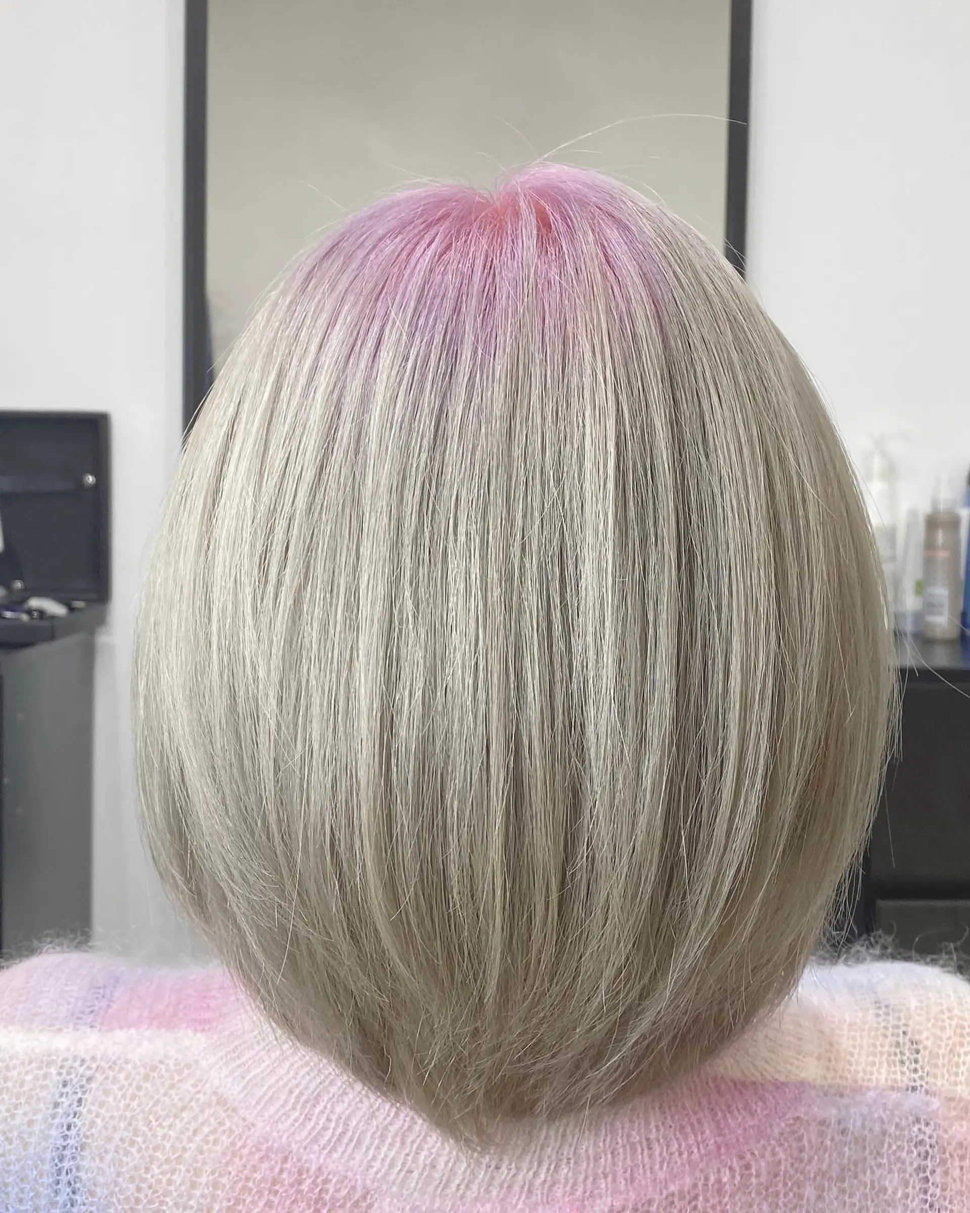 A trendy, layered bob with a striking lavender to icy silver color melt. 2