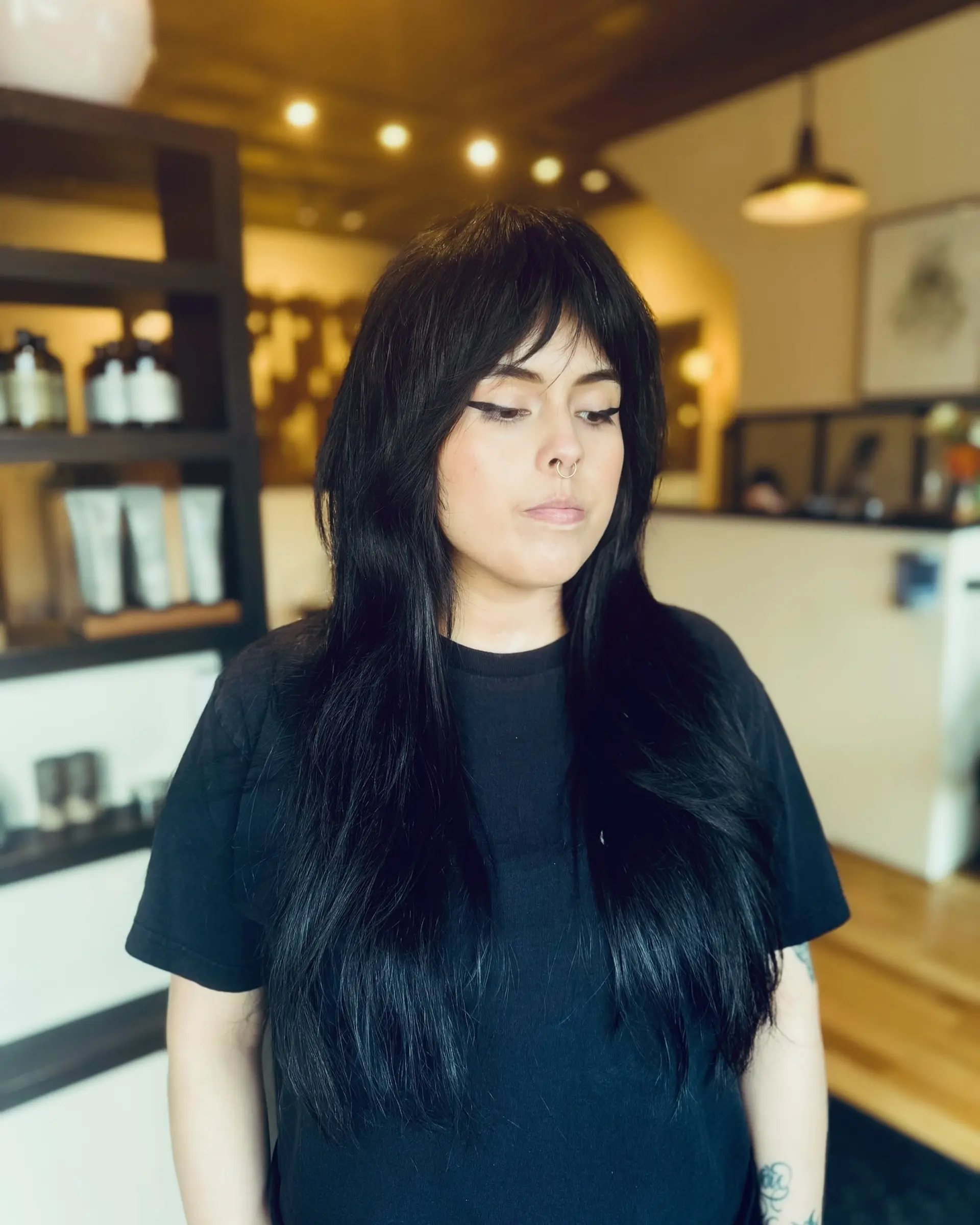 A long shag haircut with choppy layers and curtain bangs. 1