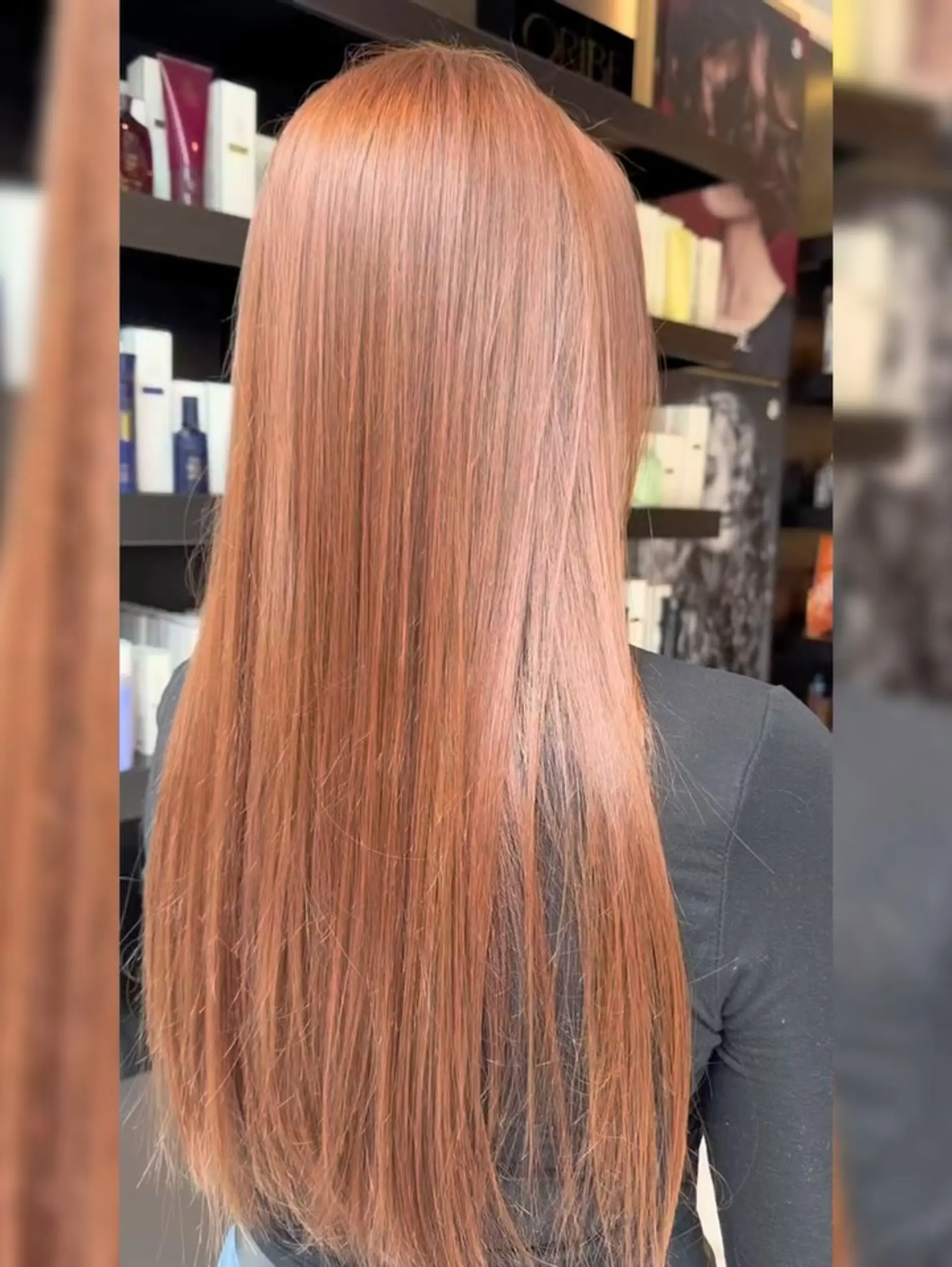 Vibrant, shiny copper hair styled straight and sleek, falling down the back. 1