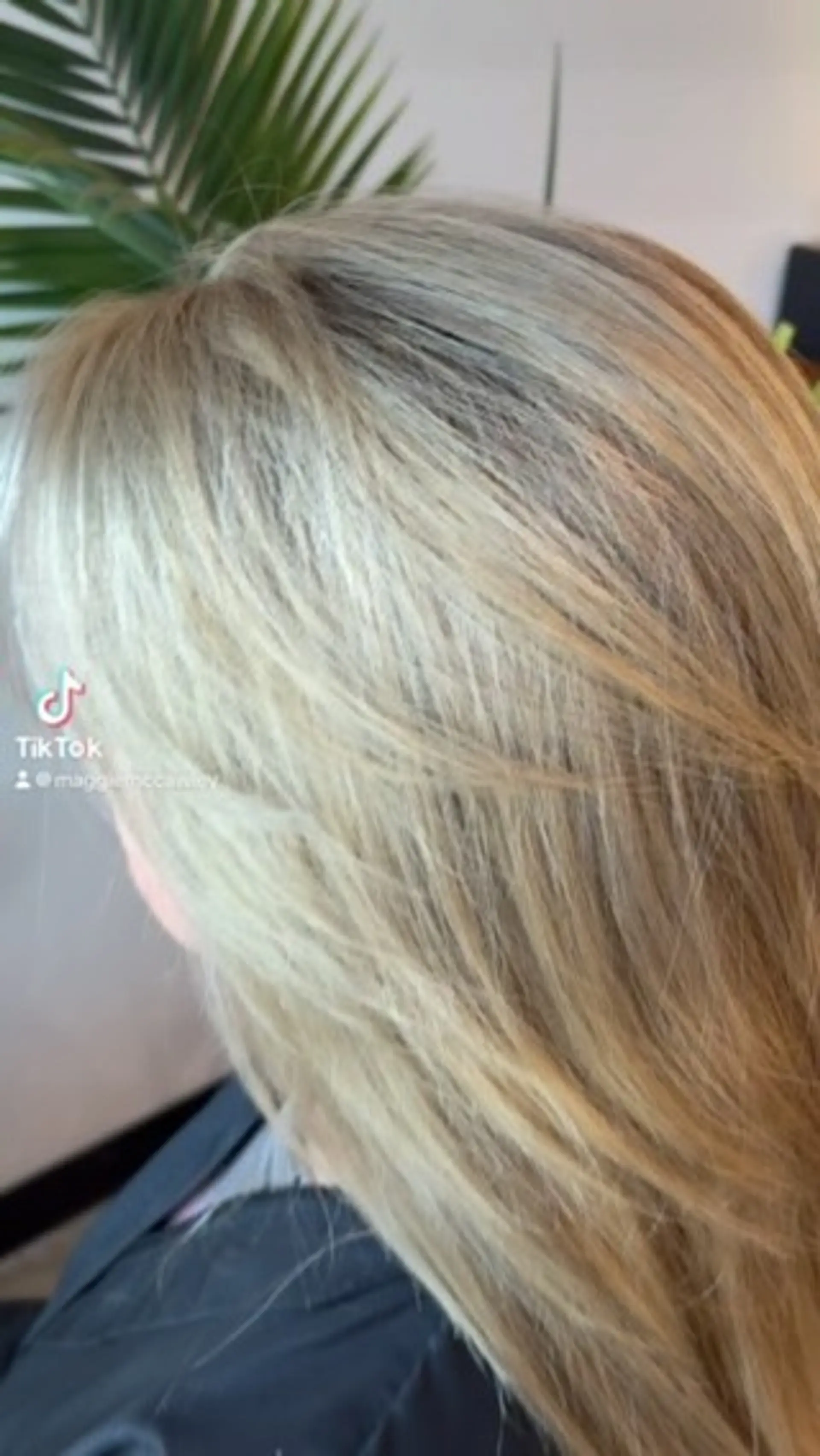 Long, smoothly blown-out hair featuring dimensional blonde highlights and soft textured layering. 1