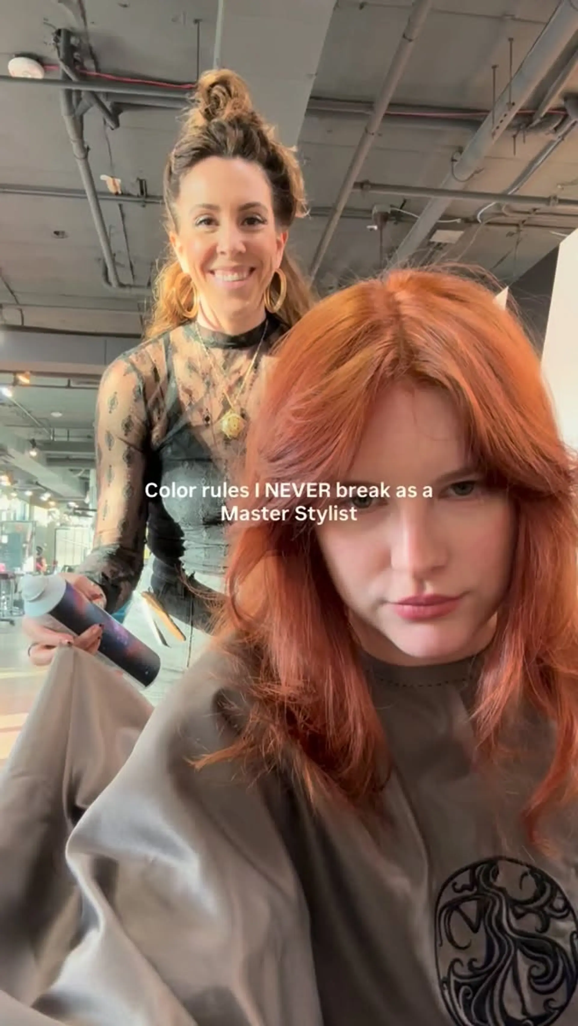 A rich copper medium-length cut styled with voluminous curtain bangs and feathered face-framing layers. 1