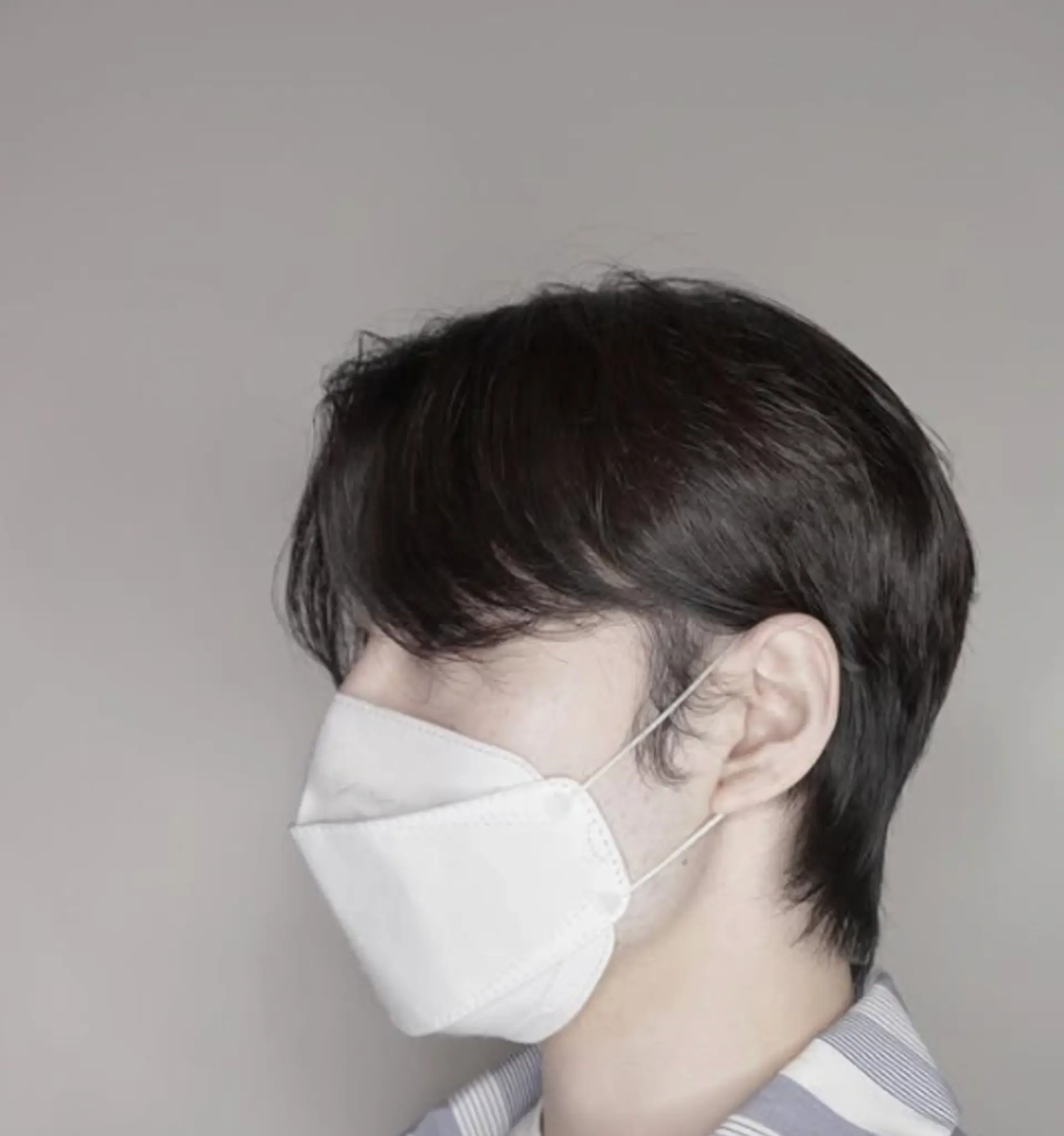 A trendy two-block haircut with soft texture and layered details. 1