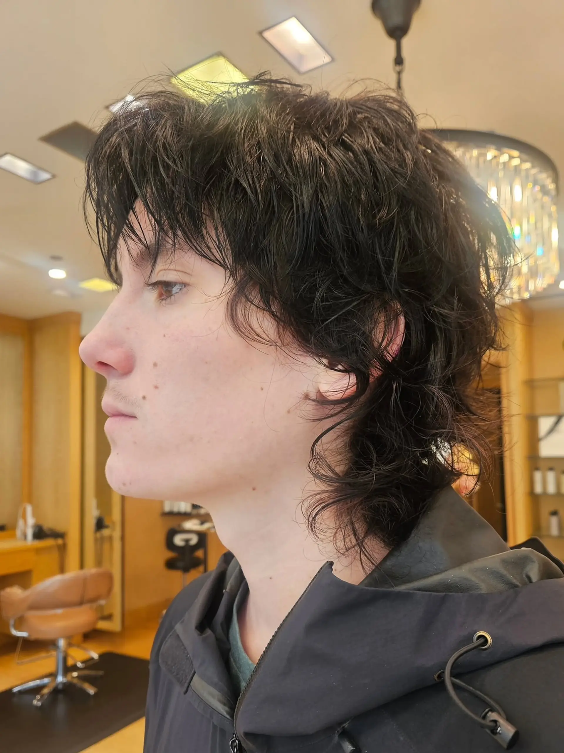 A textured shag mullet with a modern twist. It features short layers on top that blend into longer, wavy lengths in the back. 1