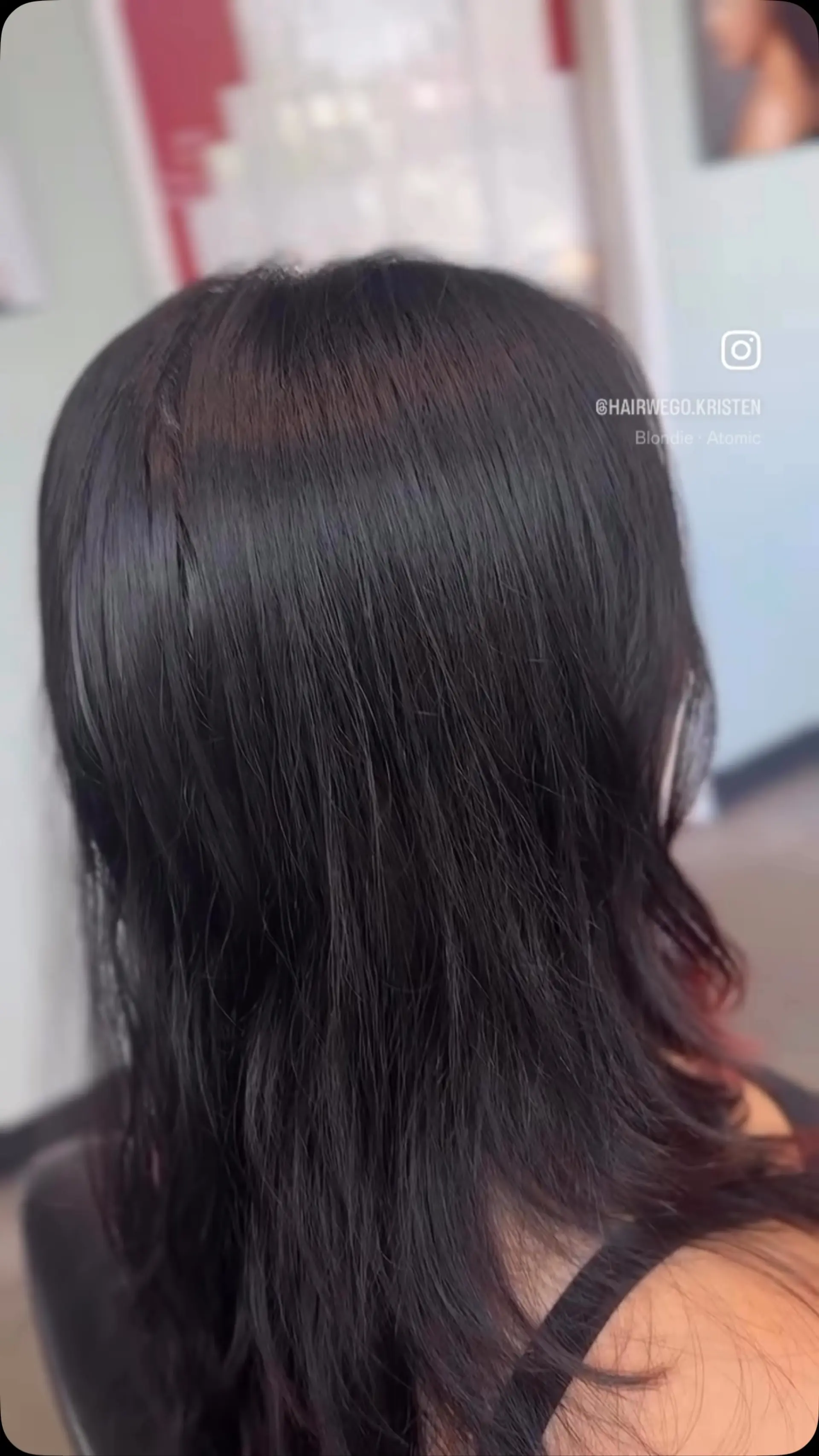 Medium-length dark brunette hair cut into soft layers with subtle crimson undertones peeking through at the ends. 1
