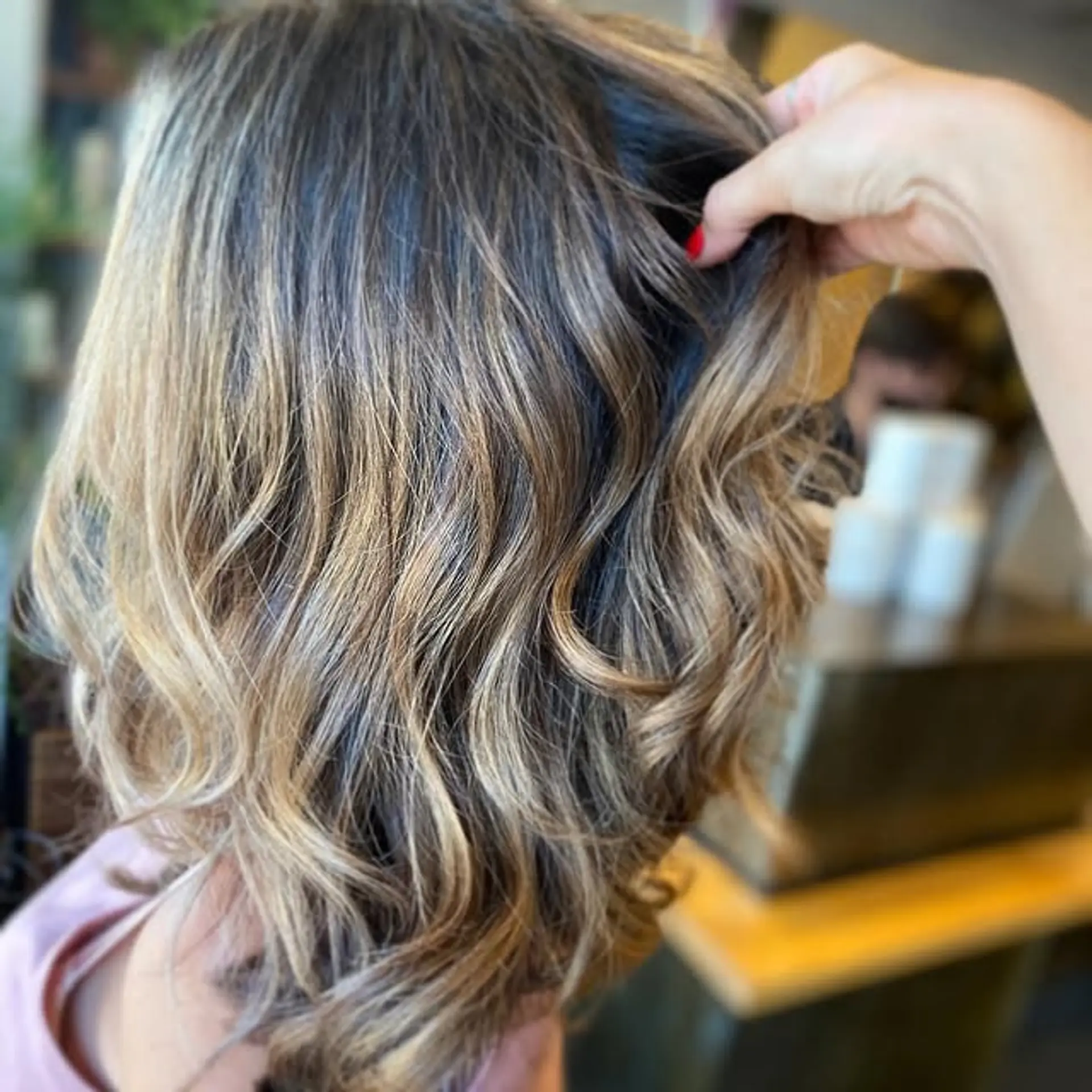 A medium length wavy bob with a beautiful bronde balayage effect. 1