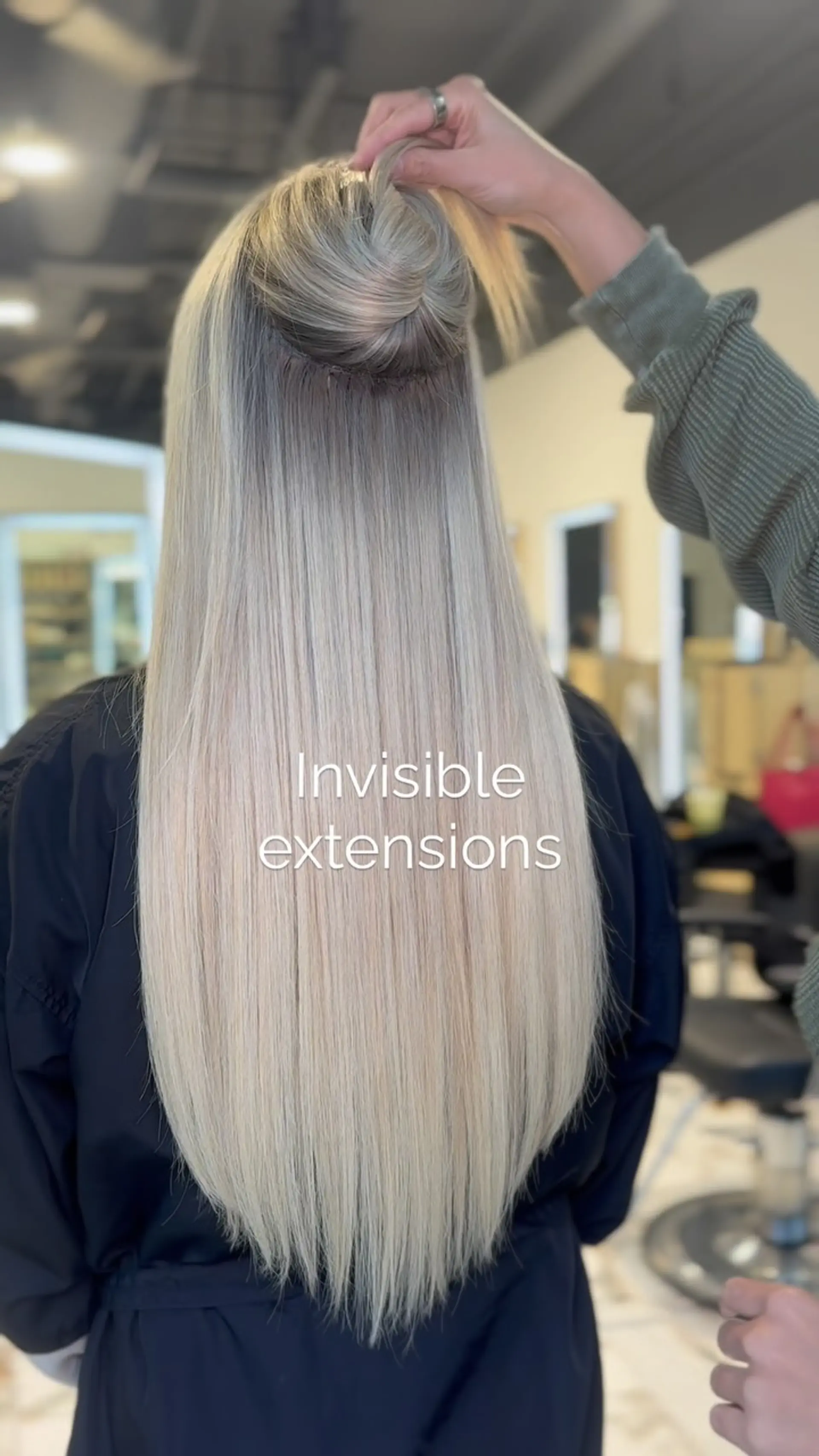 Long, straight platinum blonde hair enhanced with seamless invisible weft extensions. 1