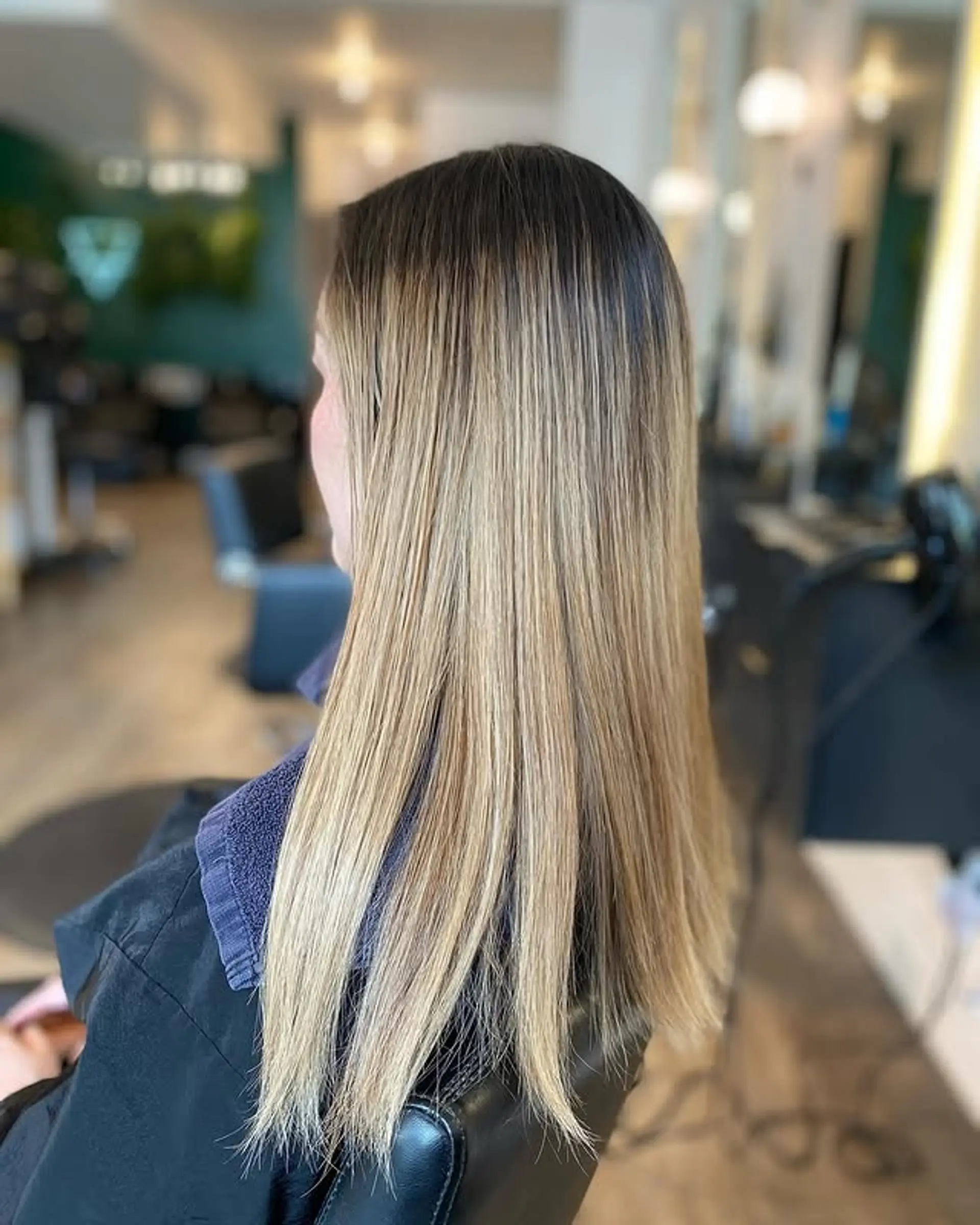 A bronde balayage with long layers creating a seamless blend of brown and blonde. 1