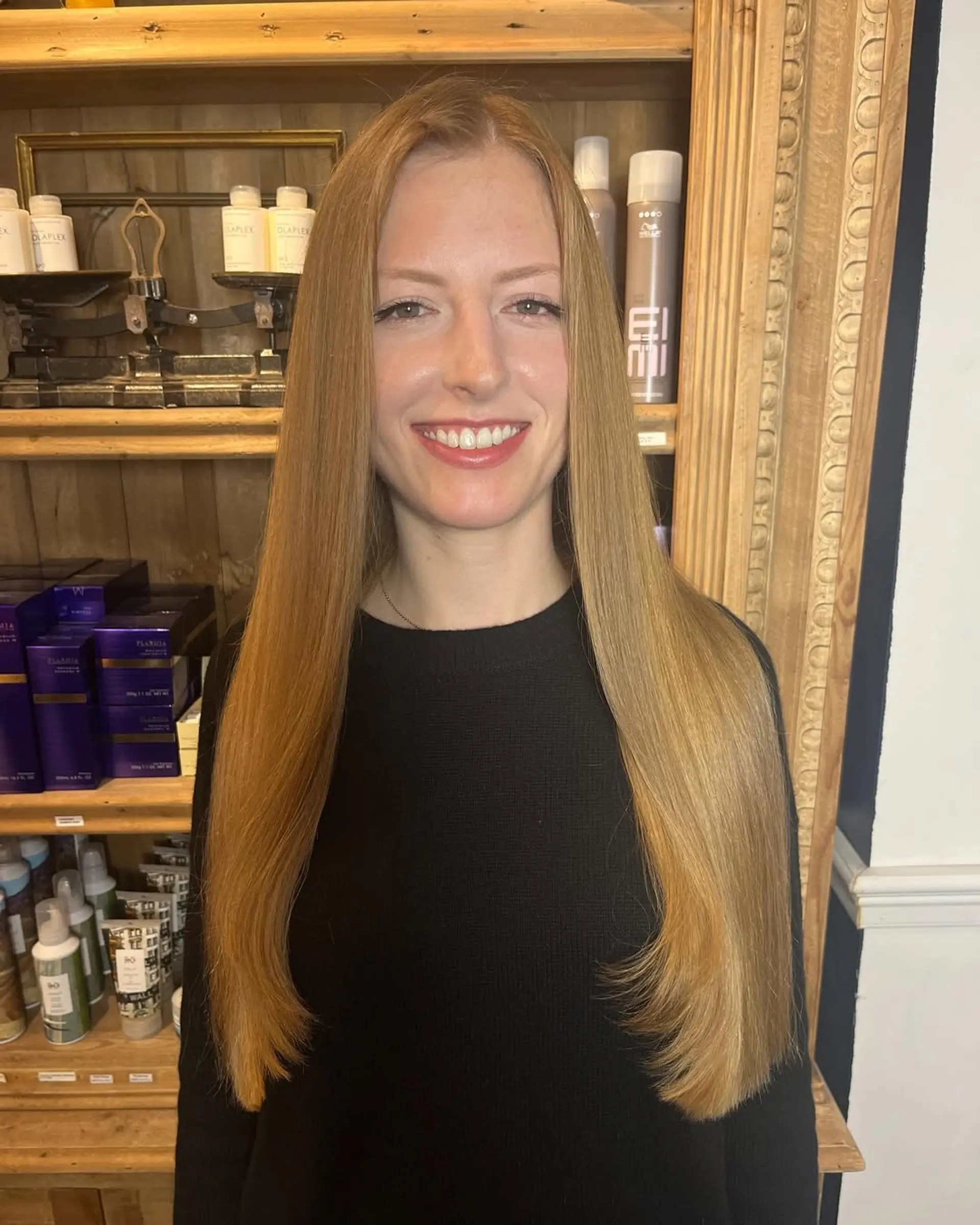 Very long, straight blonde hair with a smooth texture and even cut, showcasing natural shine and full volume. 3