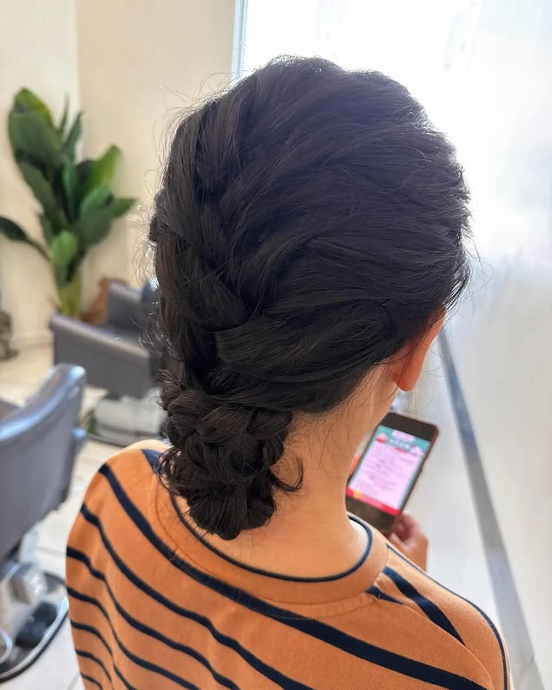 This hairstyle features an intricate braided updo, perfect for formal occasions or adding a touch of elegance to your look. 1