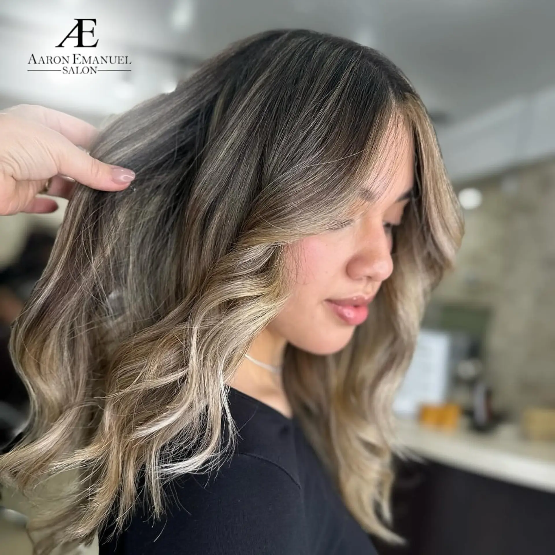 Wavy medium-length hair with ash blonde and brown balayage. 1