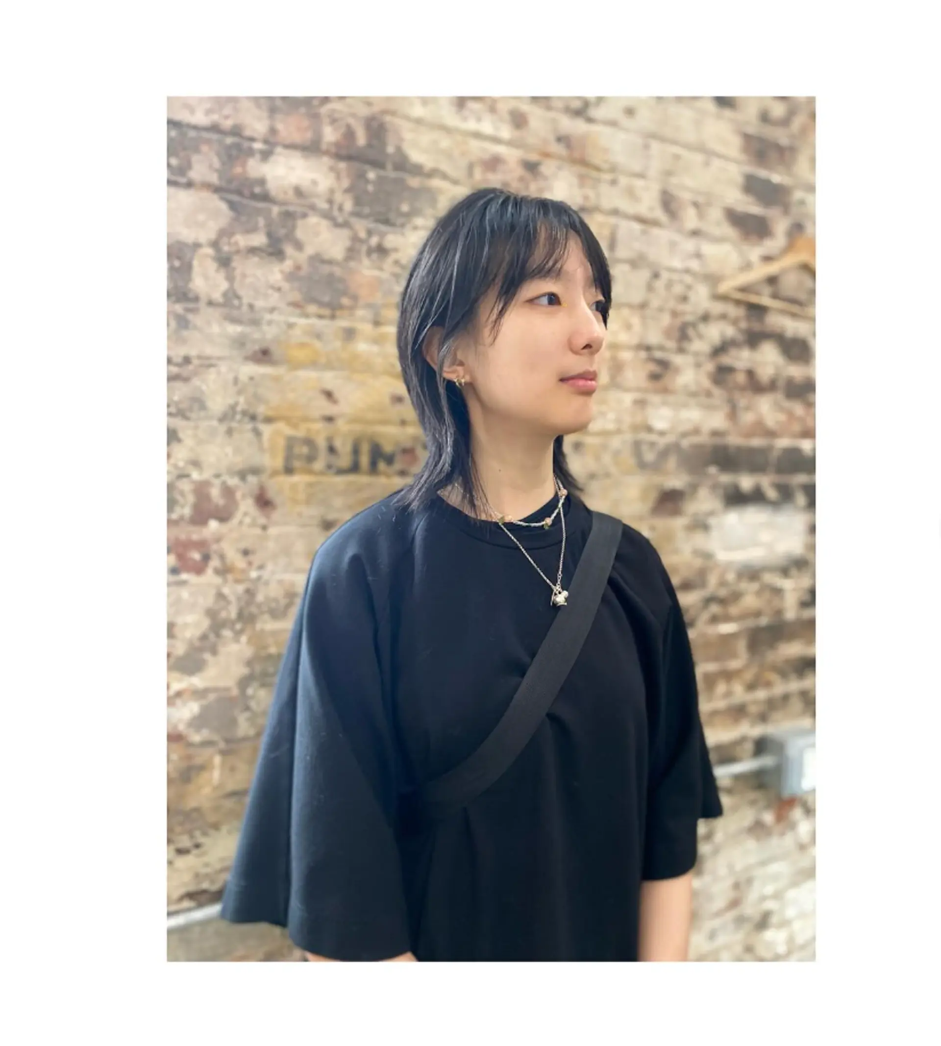 This hairstyle features a modern take on the classic mullet with shag-like layers, creating a textured and edgy look. 1