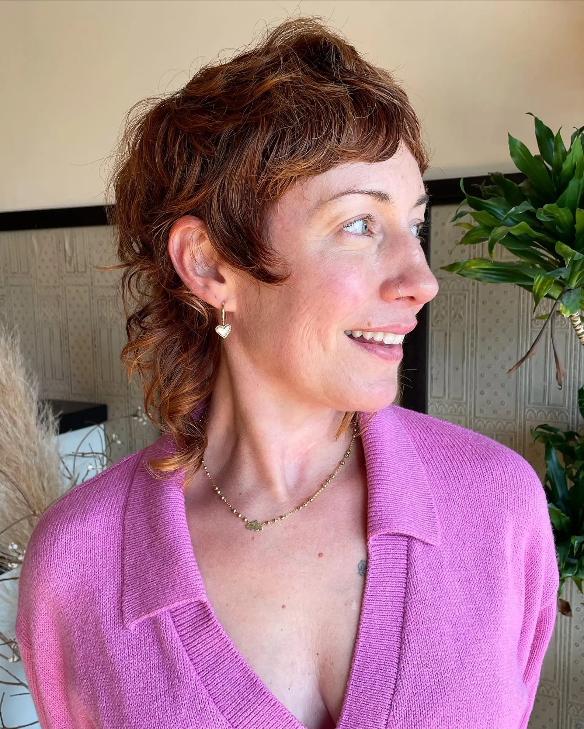 This is a modern take on the classic mullet, featuring a textured, layered cut with a copper color. 2