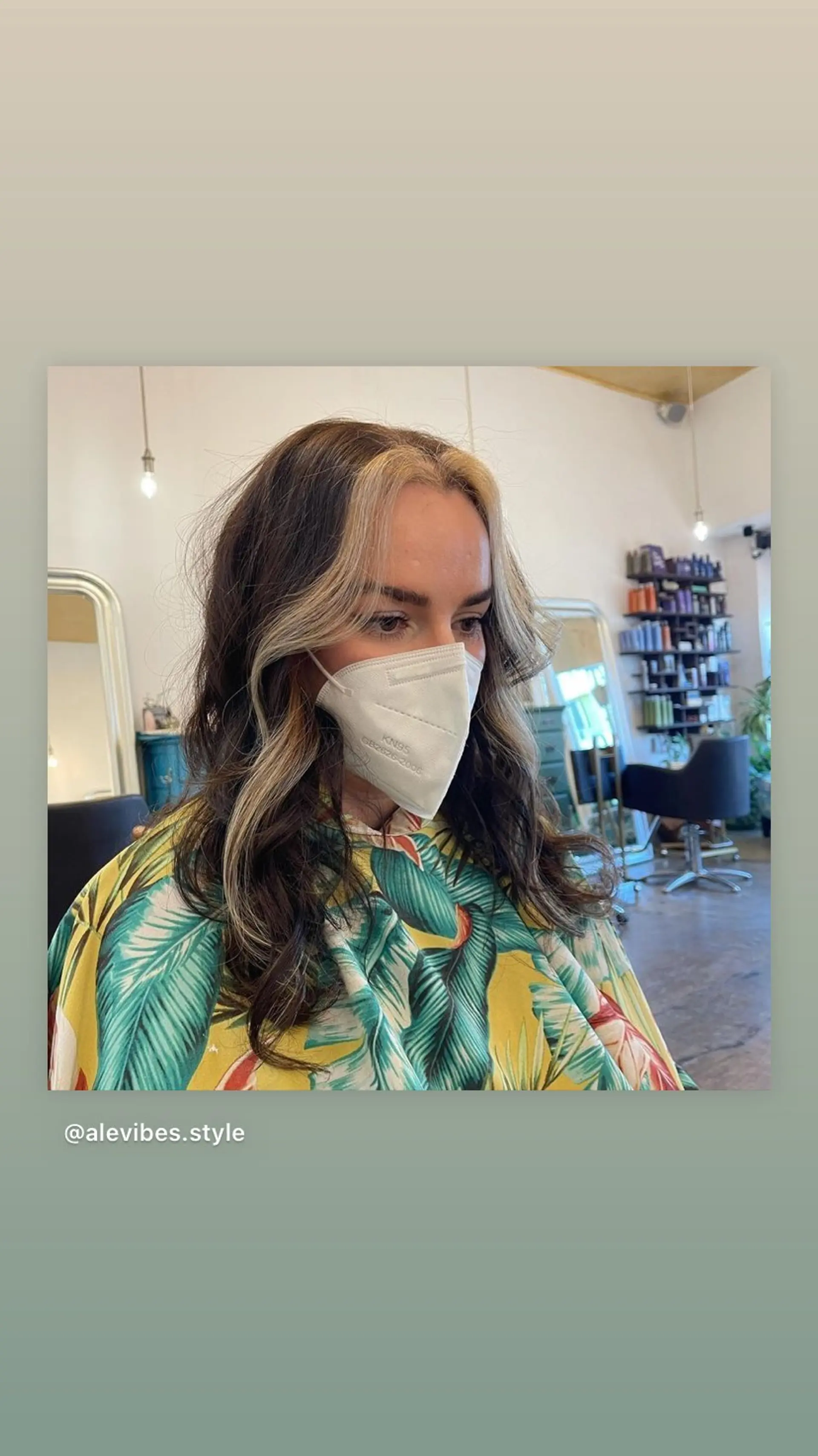 This hairstyle features a medium length brunette hair with face framing blonde highlights. 1