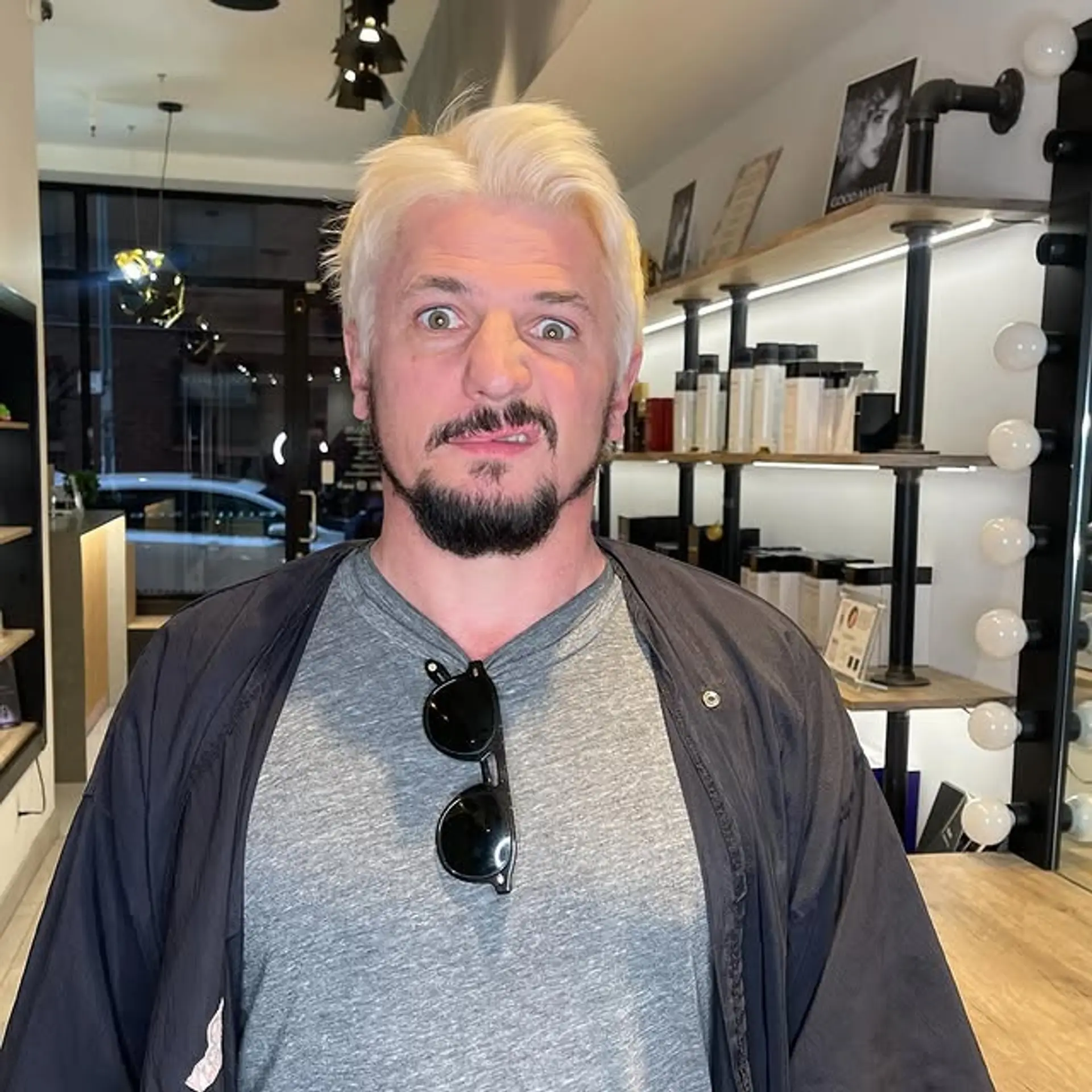 A short buzz cut with a platinum blonde color. 1