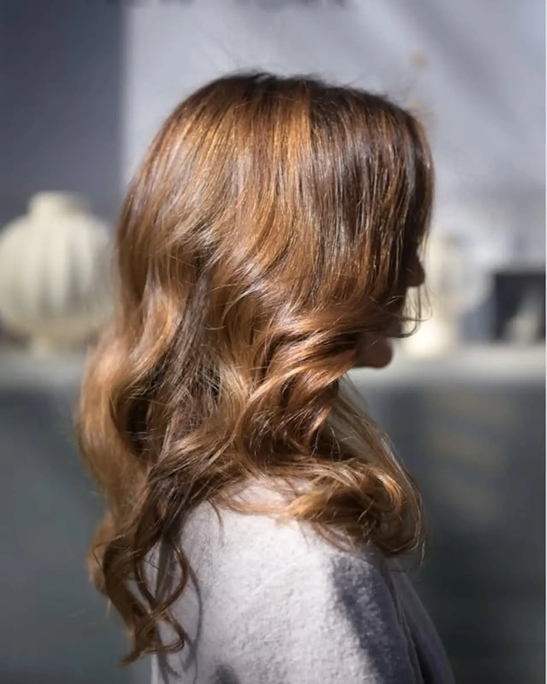 Long layered hair with soft waves and caramel highlights. 1