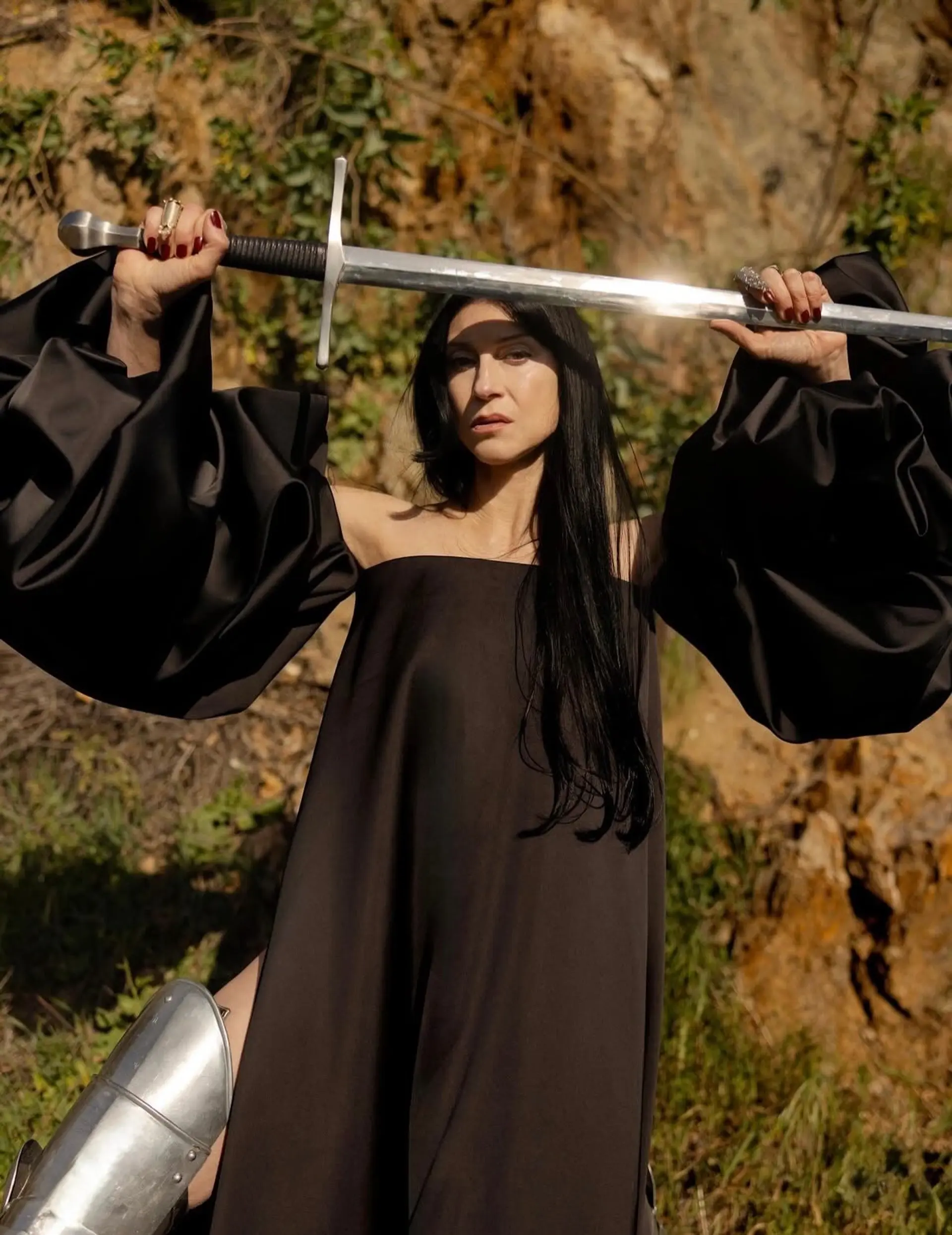 Long, smooth jet-black hair styled straight and worn loose down the front and back. 1