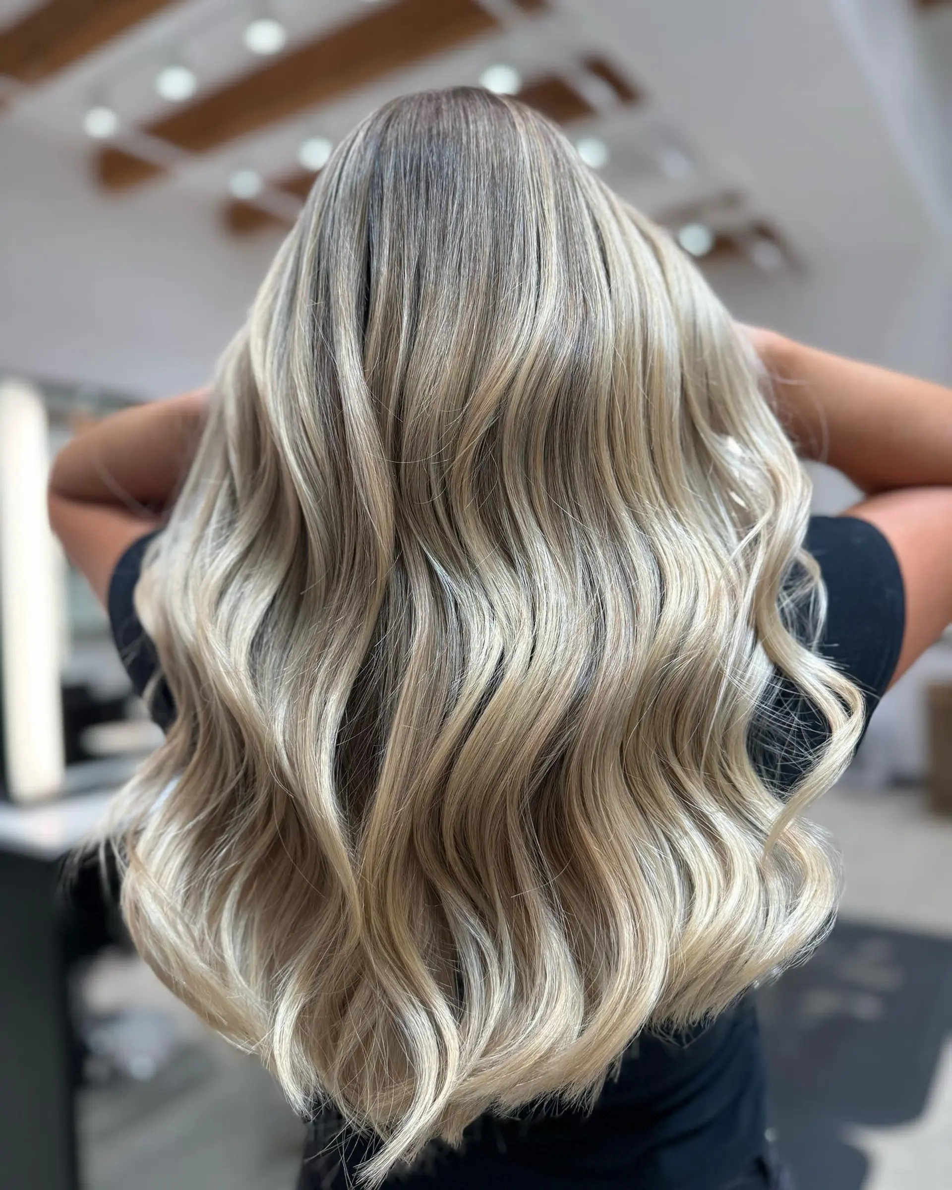 Long, soft beachy waves with dimensional blonde color. 1