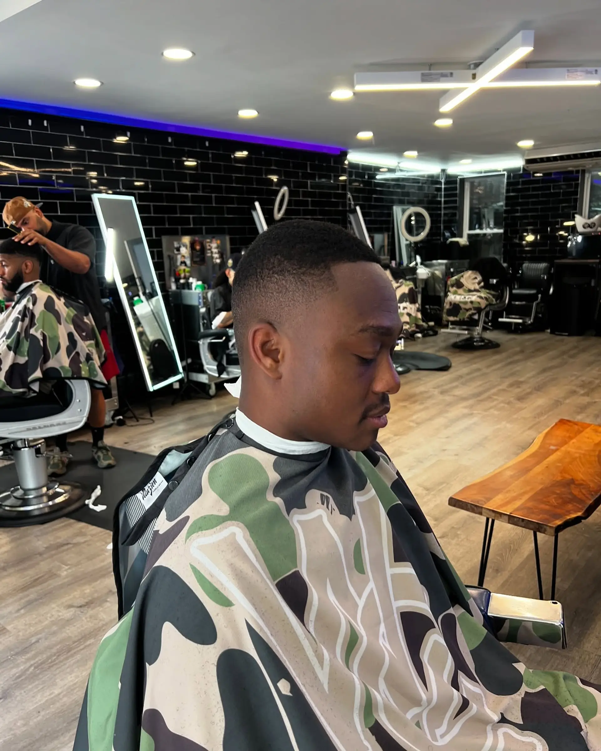 A neat buzz cut with a clean skin fade along the sides and a sharp edge-up. 1