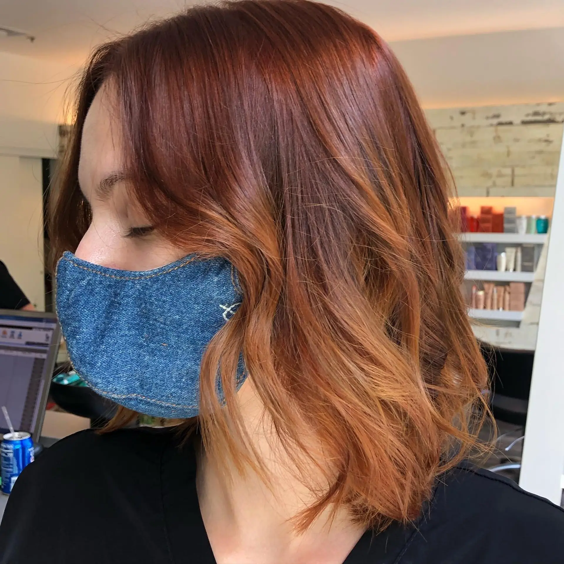 A shoulder-length lob with loose, dimensional waves in a rich auburn shade. 1