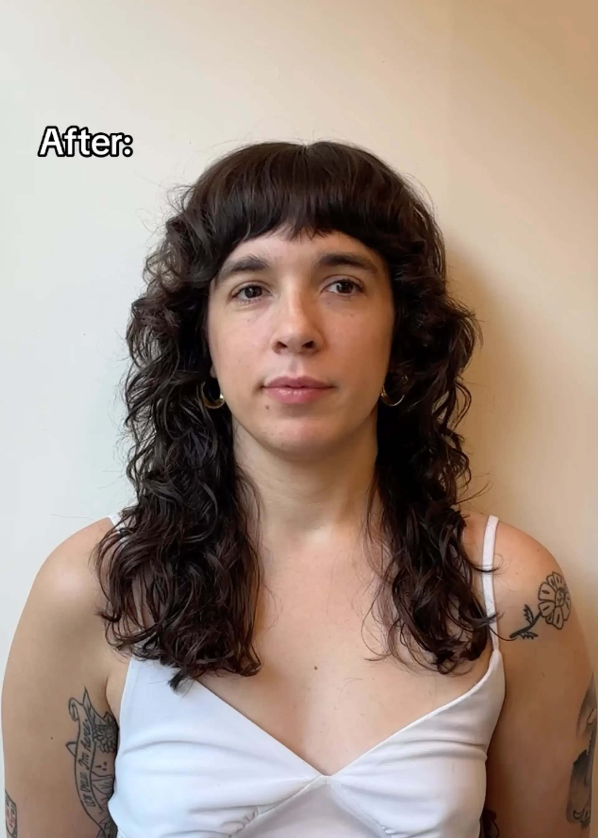 Shaggy haircut with shorter bangs done with both a straight razor and scissors. Styled with Hymn by Reverie 2