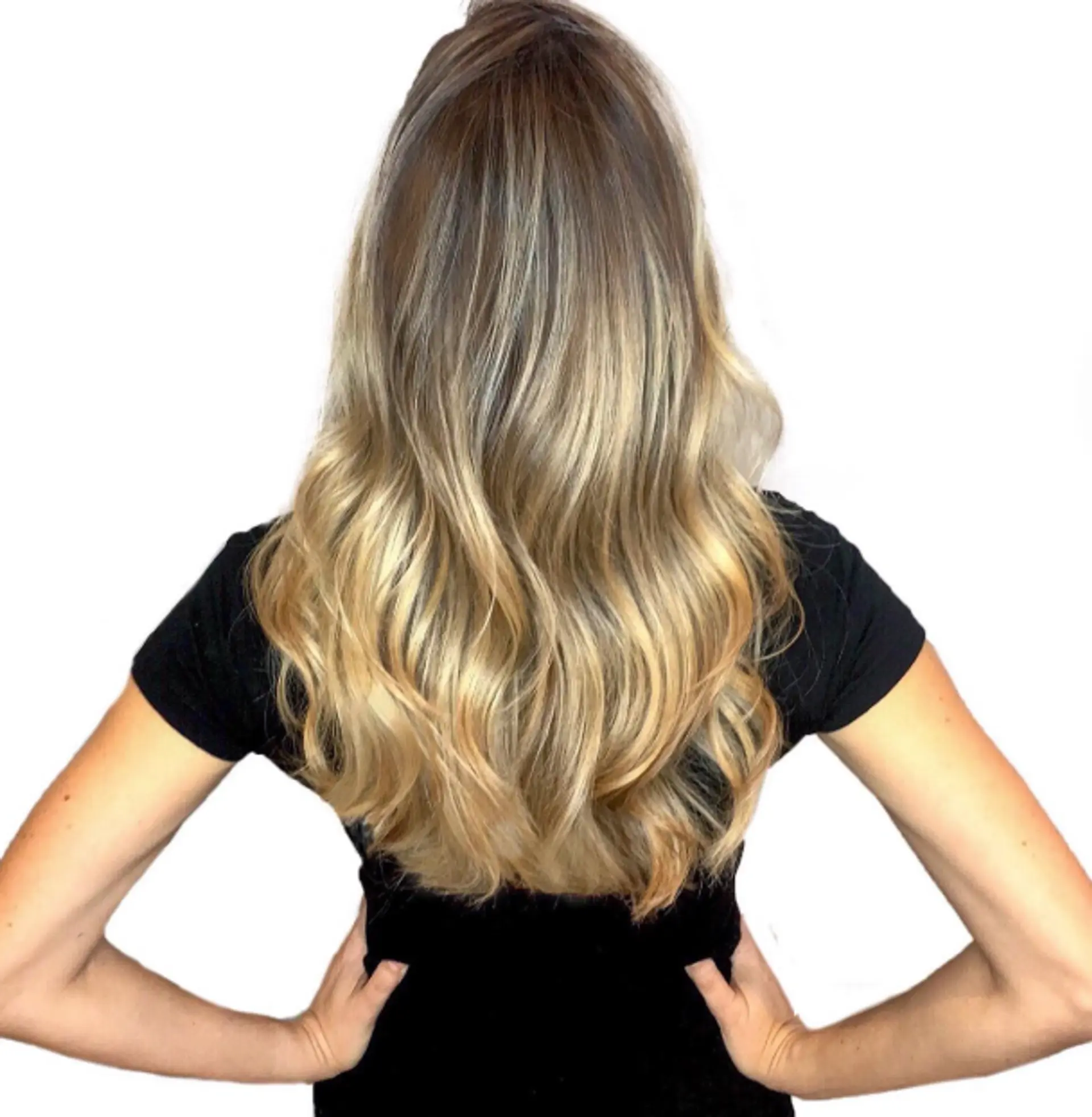 Long wavy hair with a golden blonde balayage. 1