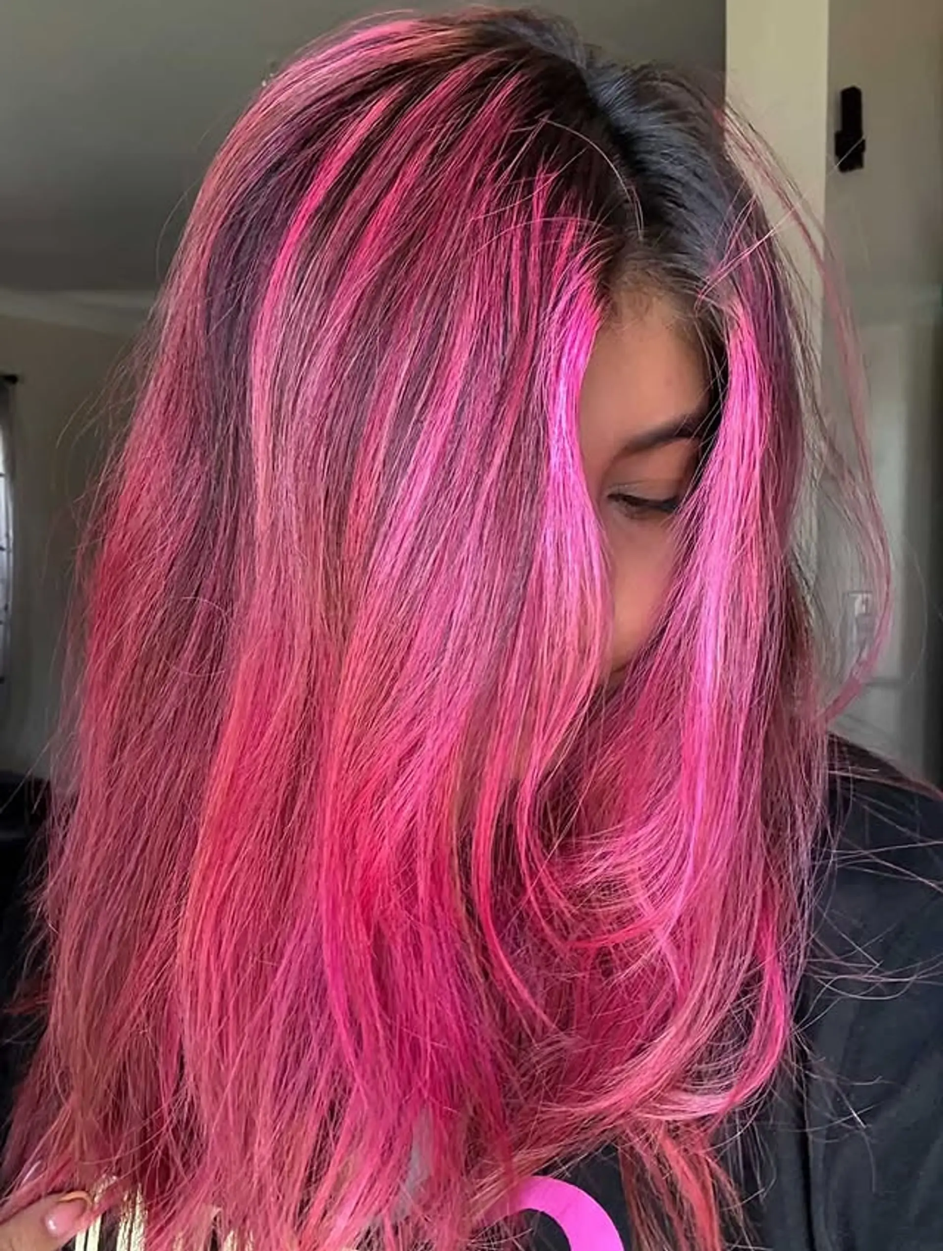 A striking pink balayage with a blend of pink and magenta hues, perfect for those wanting a bold and colorful transformation. 1