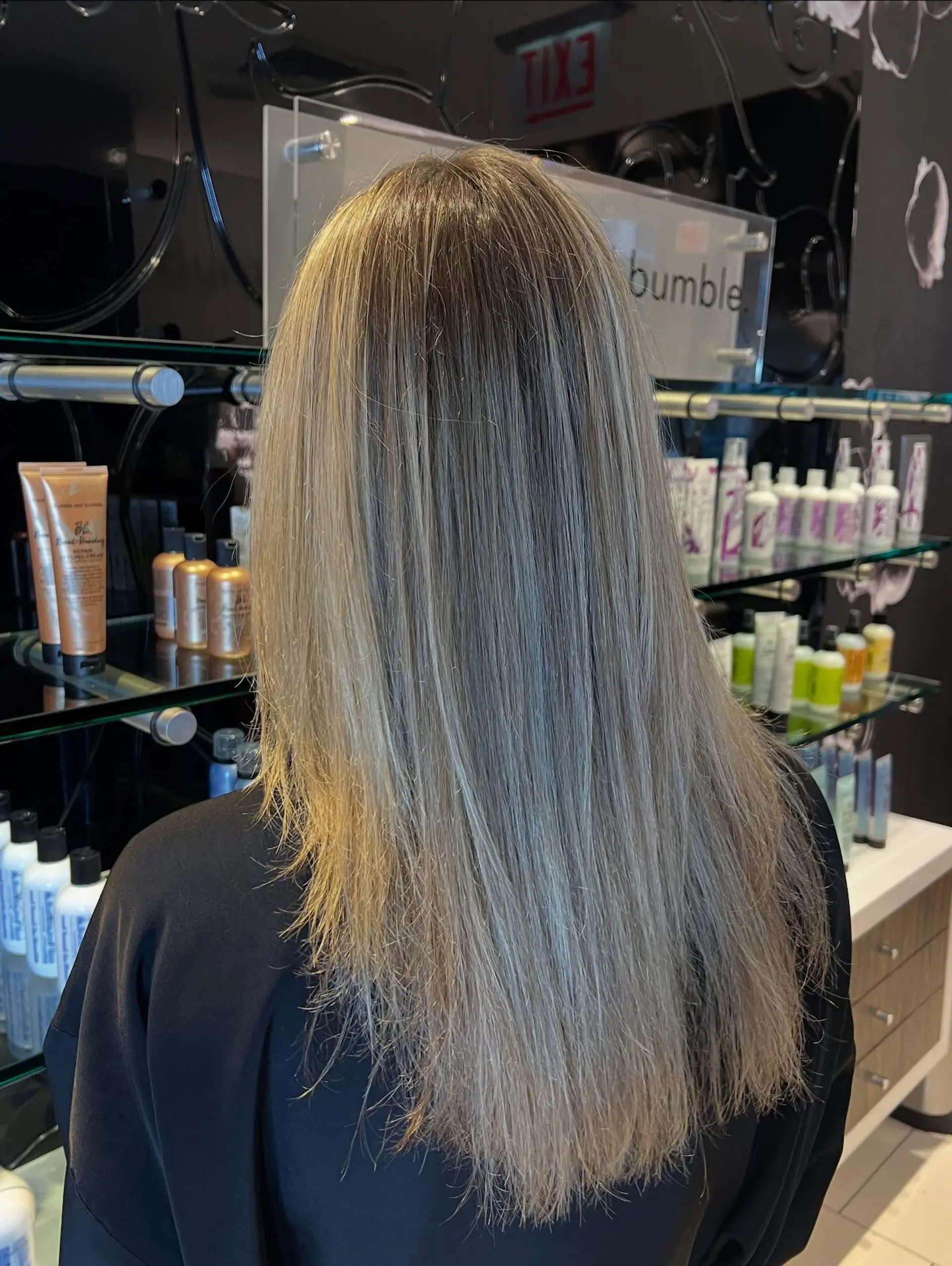 Long straight hair featuring a seamless, soft blonde balayage blended from a natural light brown base. 1