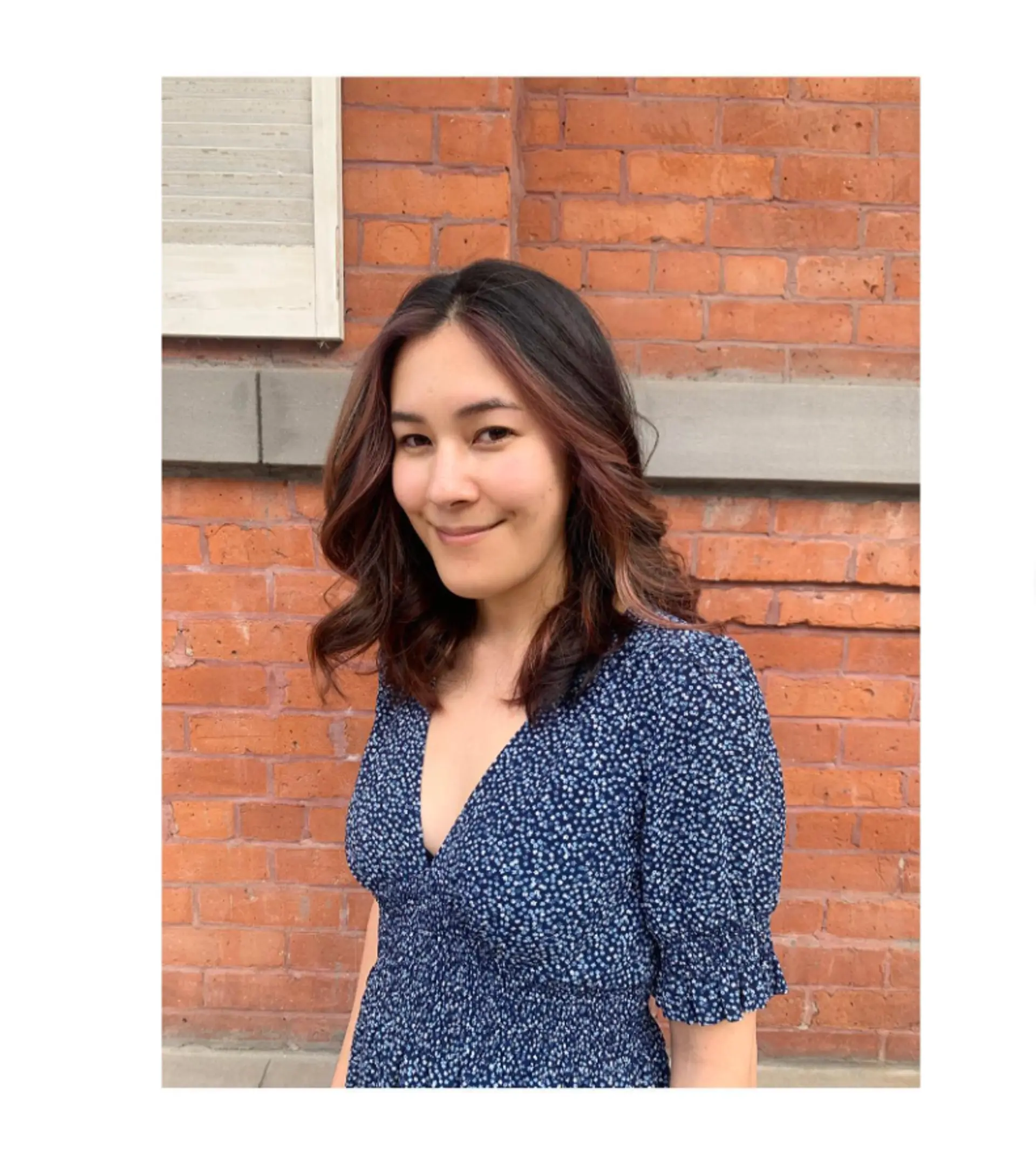 A medium-length wavy hairstyle with subtle bronzed highlights. 1