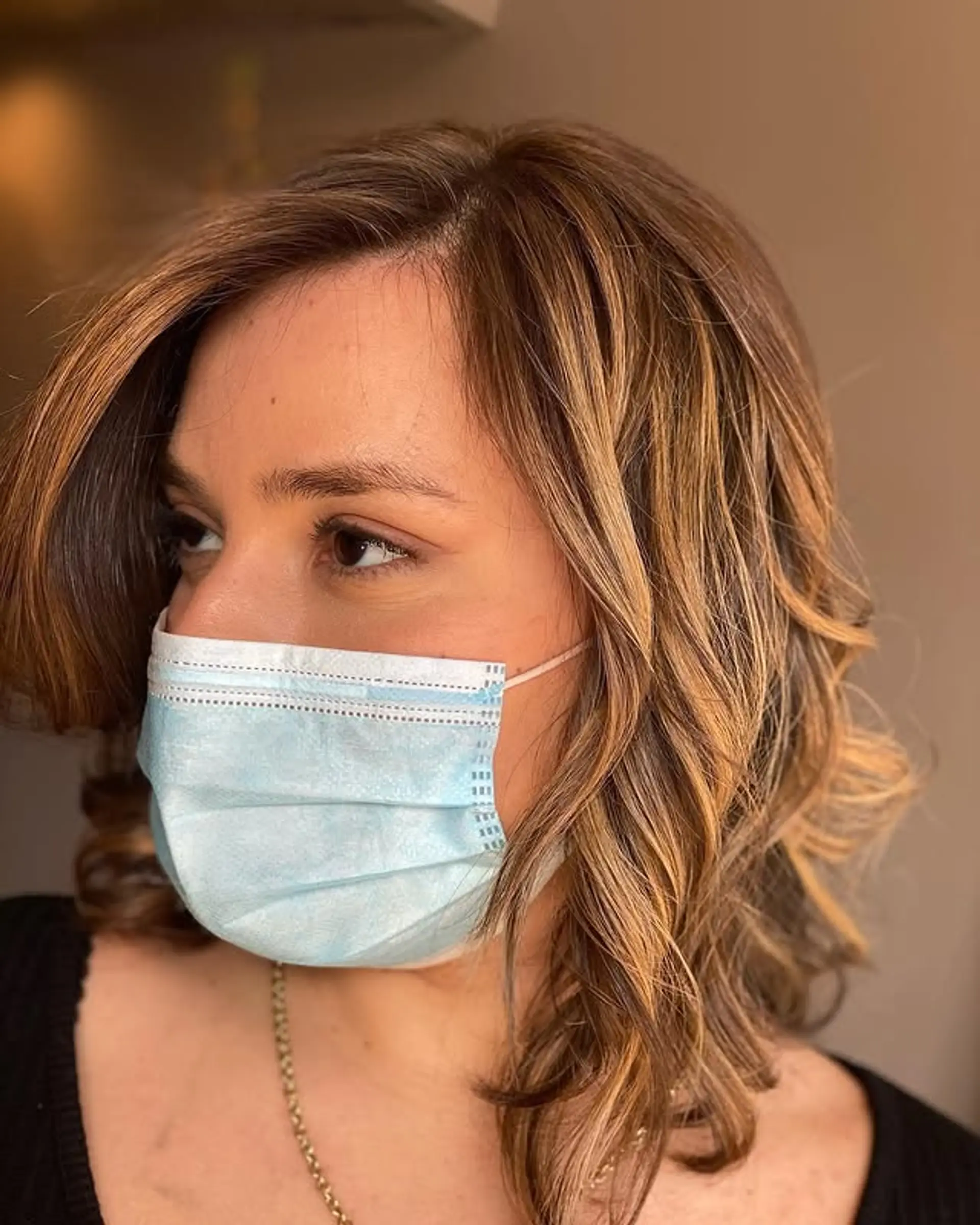 A medium-length wavy bob with a beautiful bronde color achieved through expertly placed highlights. 1