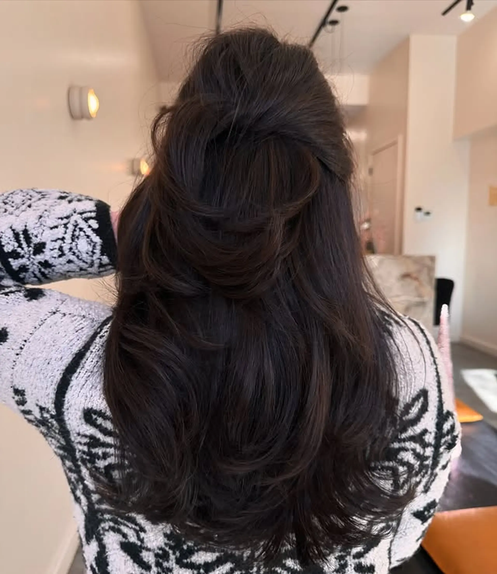A layered long hairstyle with volume and face-framing layers. 1