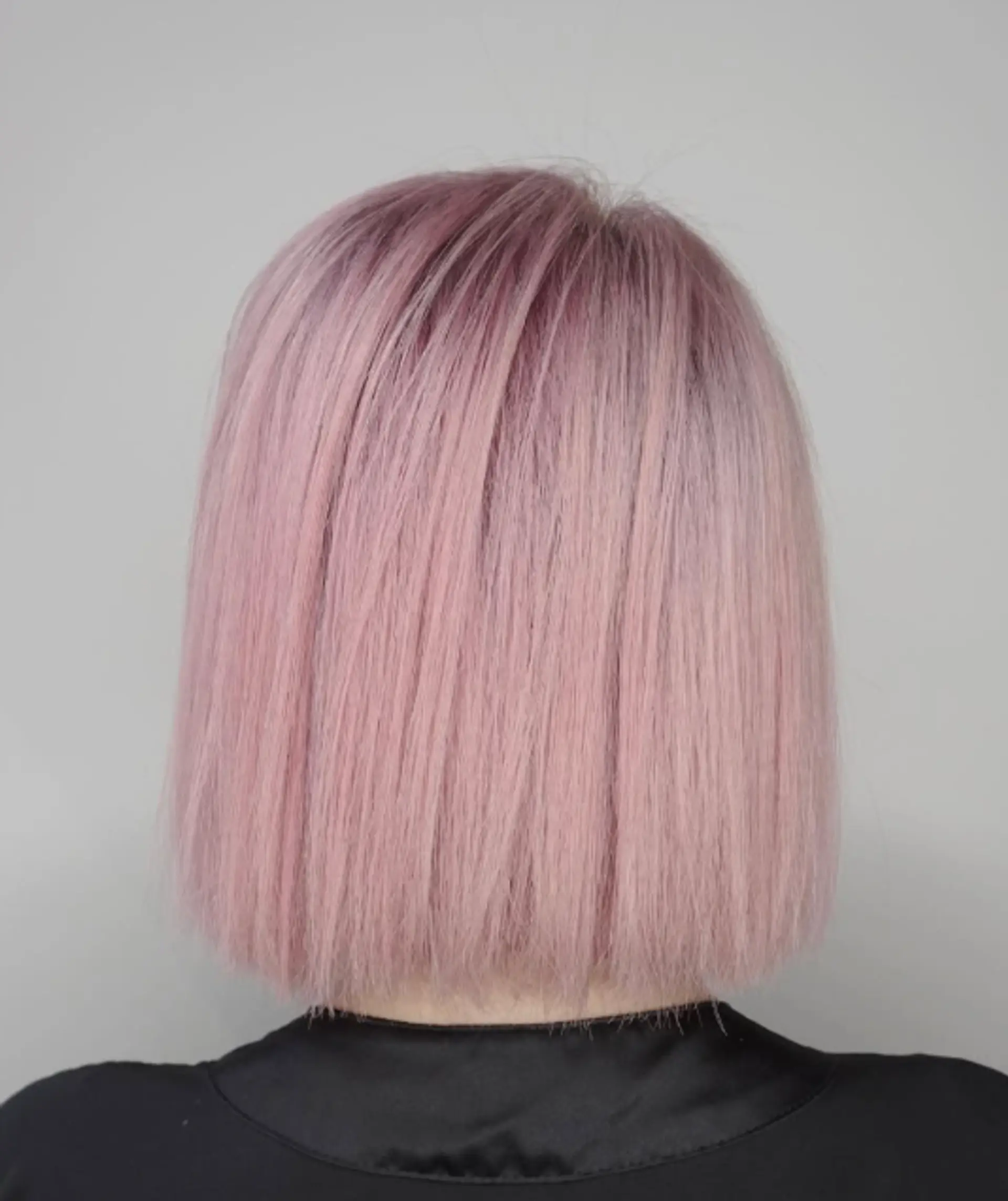 A blunt bob with a clean, even cut and straight hair. 1