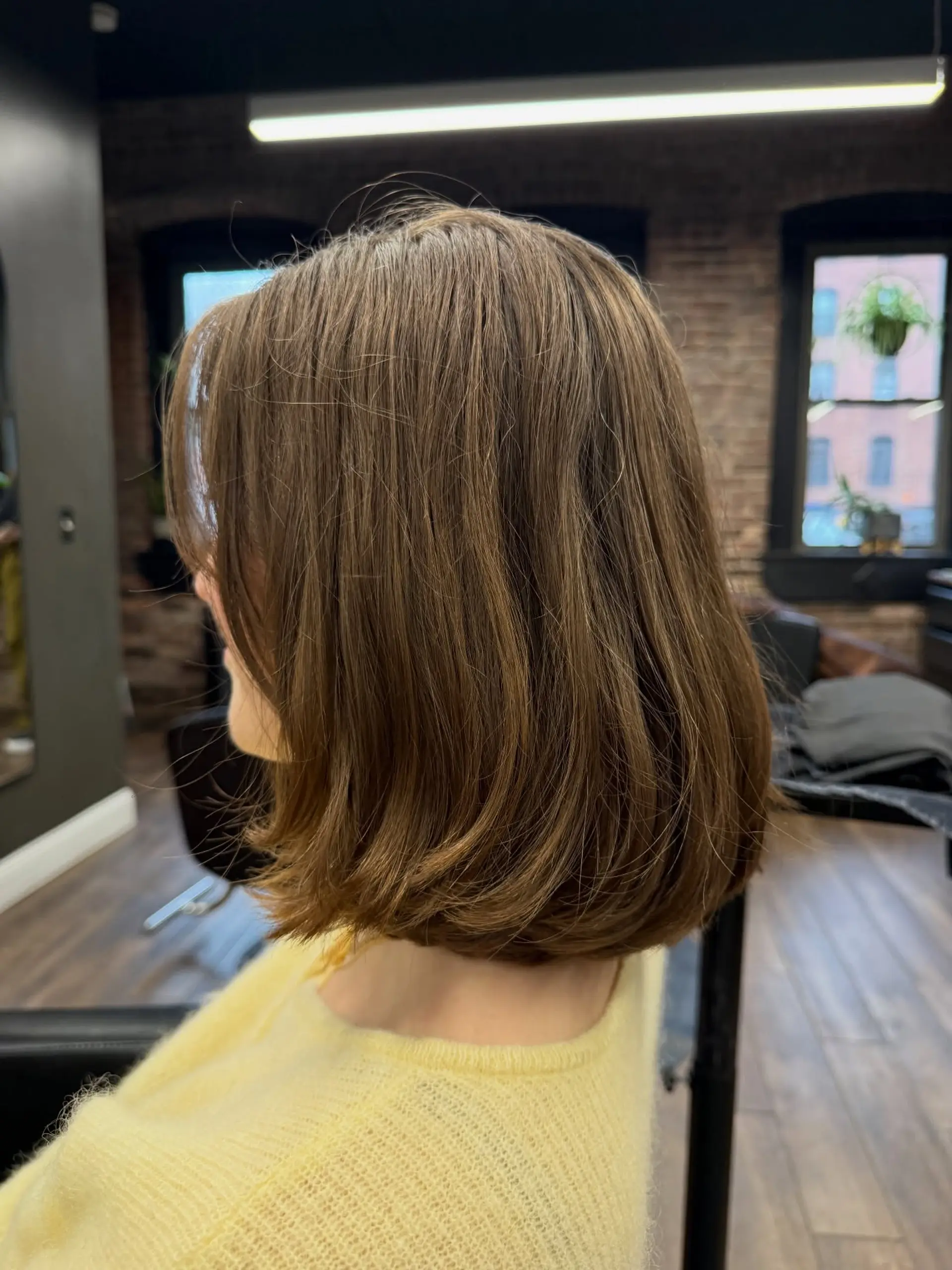 A sleek, shoulder-grazing bob haircut with gently curved ends and soft interior layers for natural volume. 1