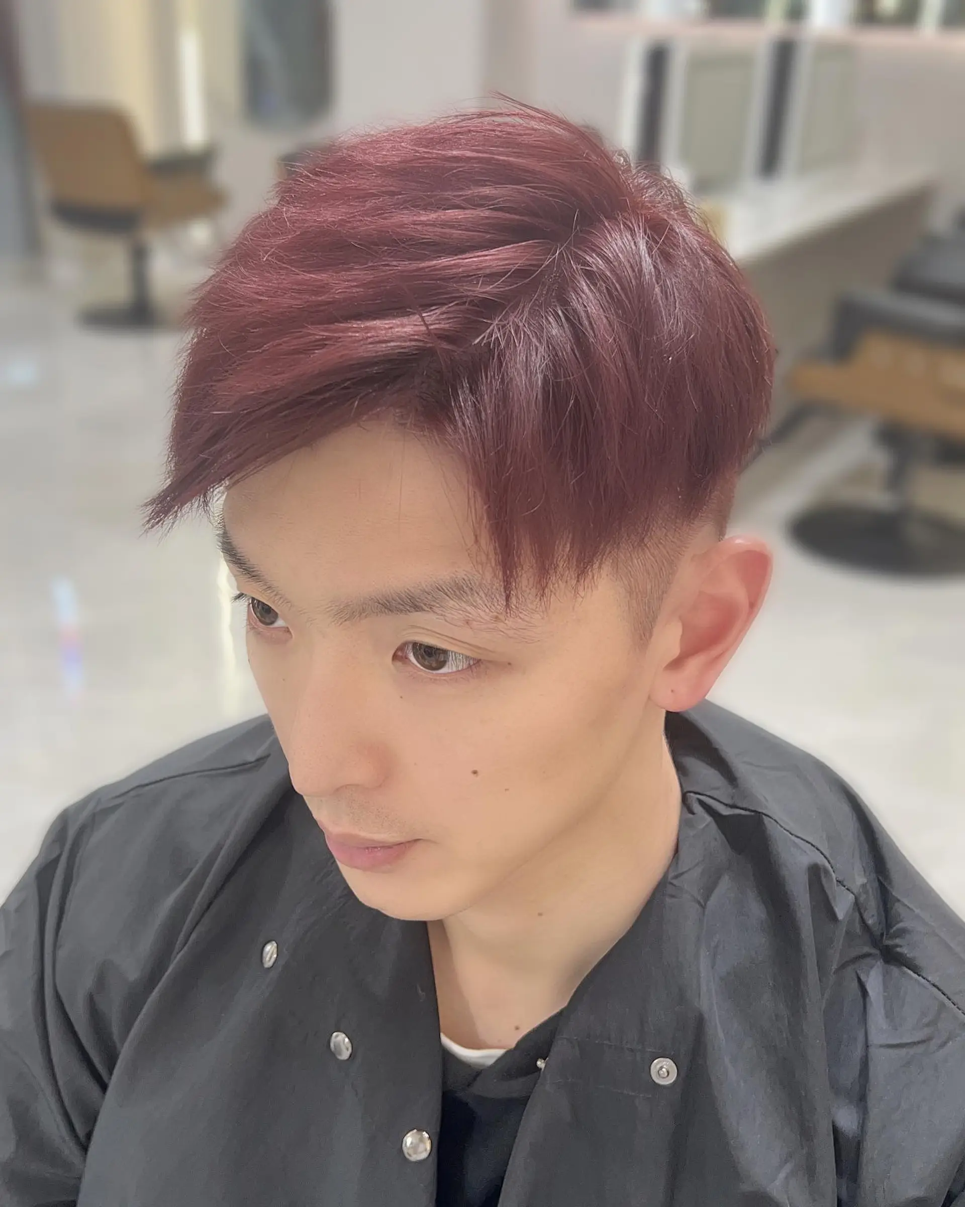 Short, textured crop with tapered sides. 1