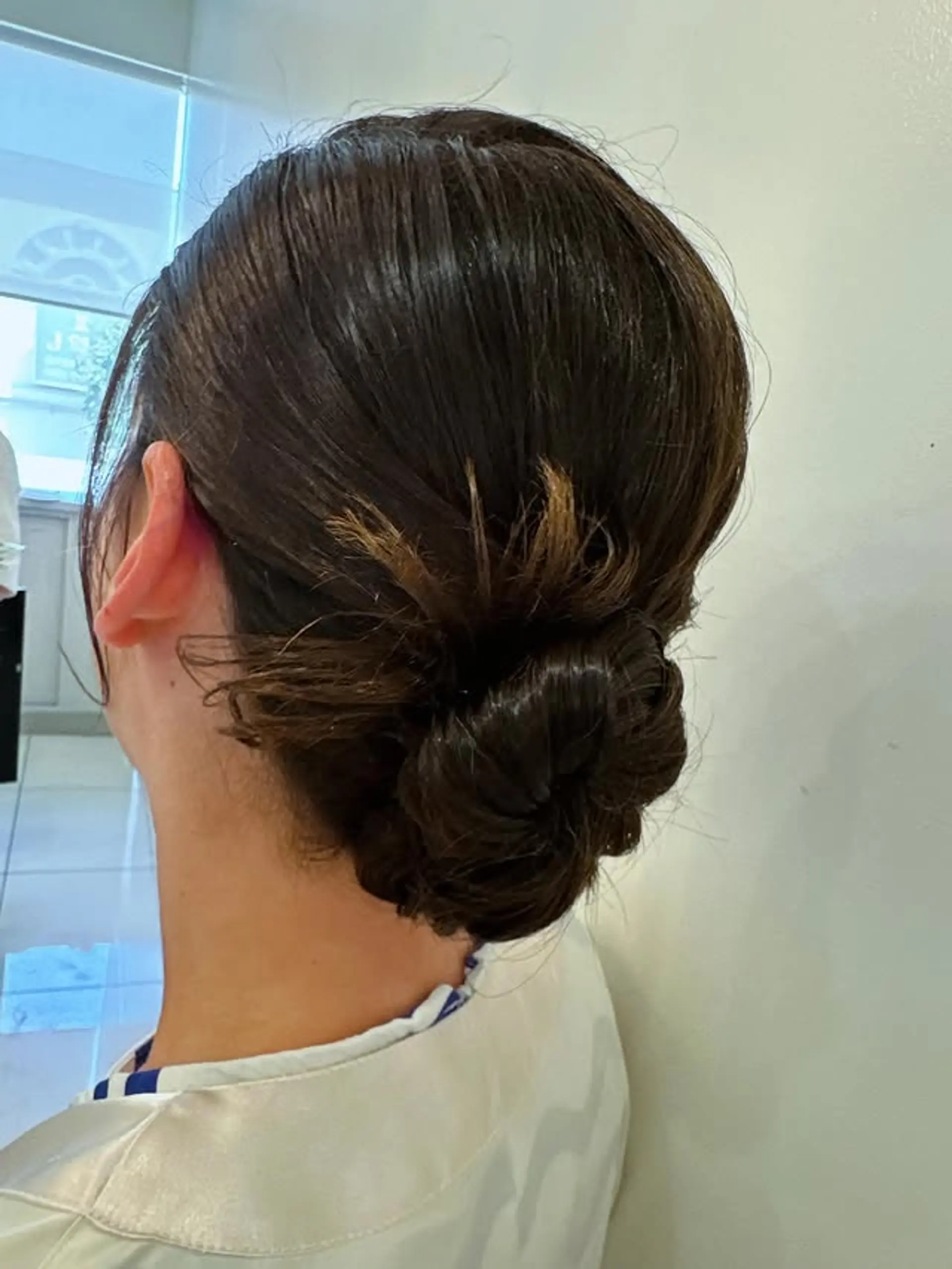 A sleek and elegant twisted bun updo. 1