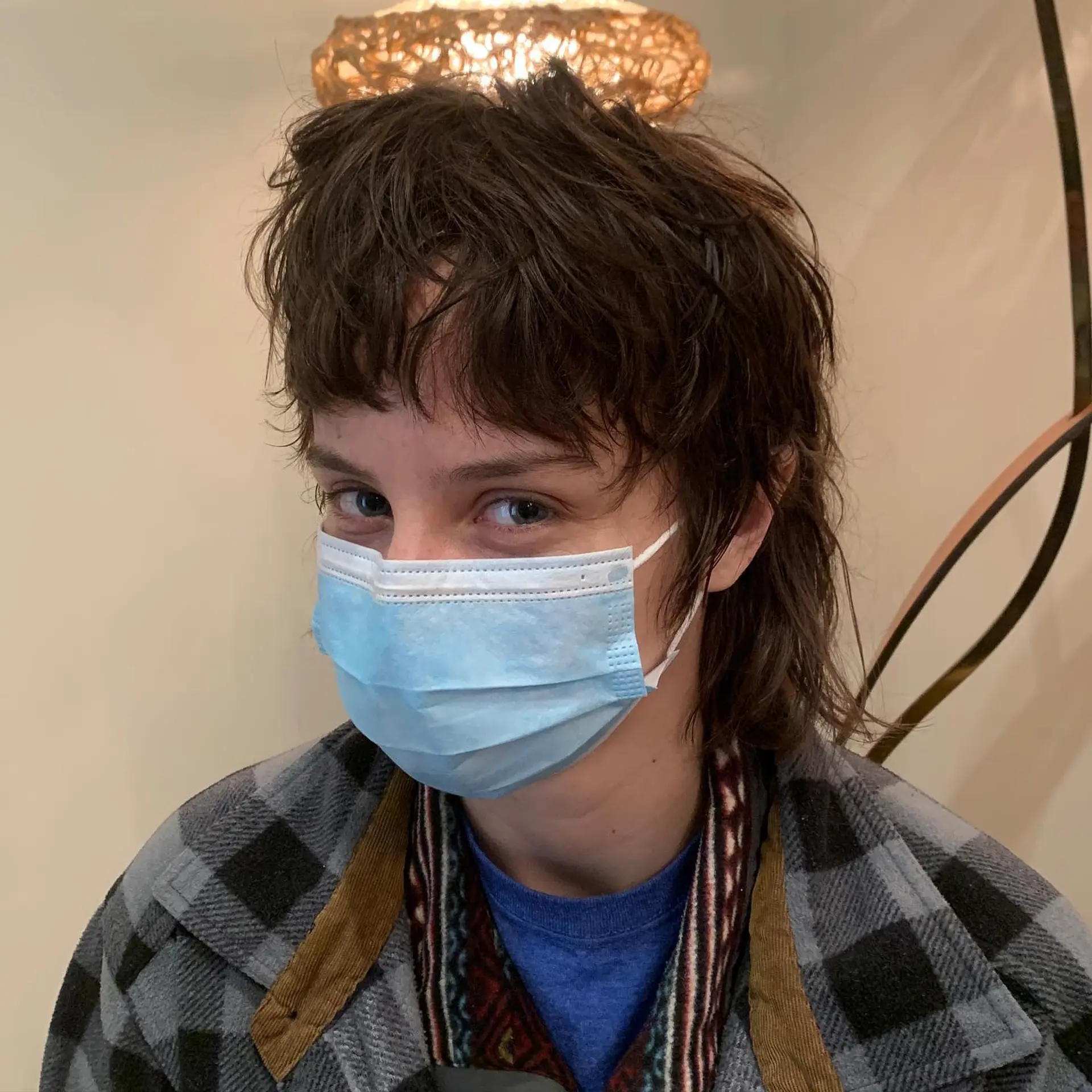 A choppy, layered shag mullet with a textured, messy finish. 2