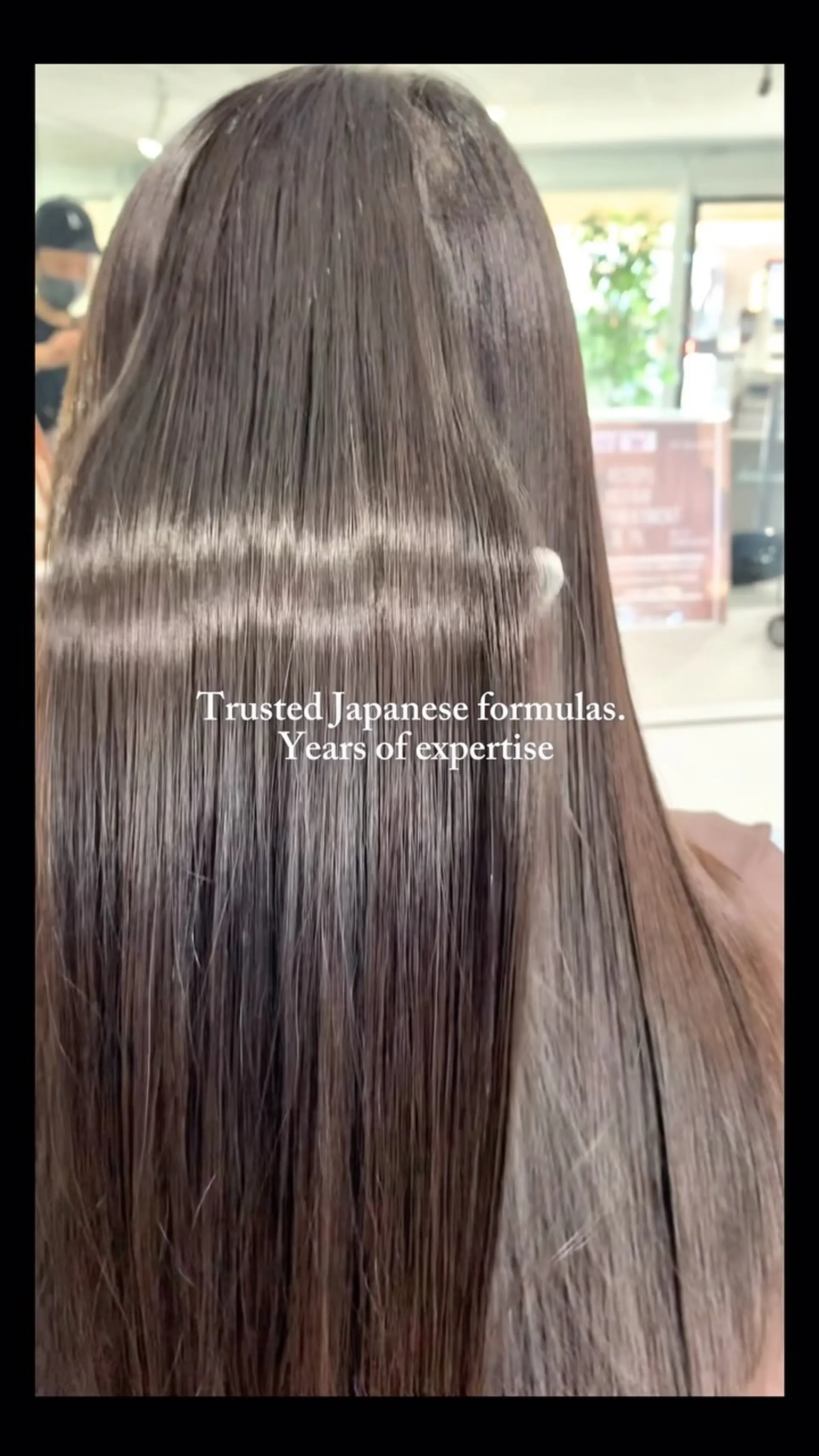 Ultra-sleek, pin-straight long dark hair with high gloss and smooth texture. 1