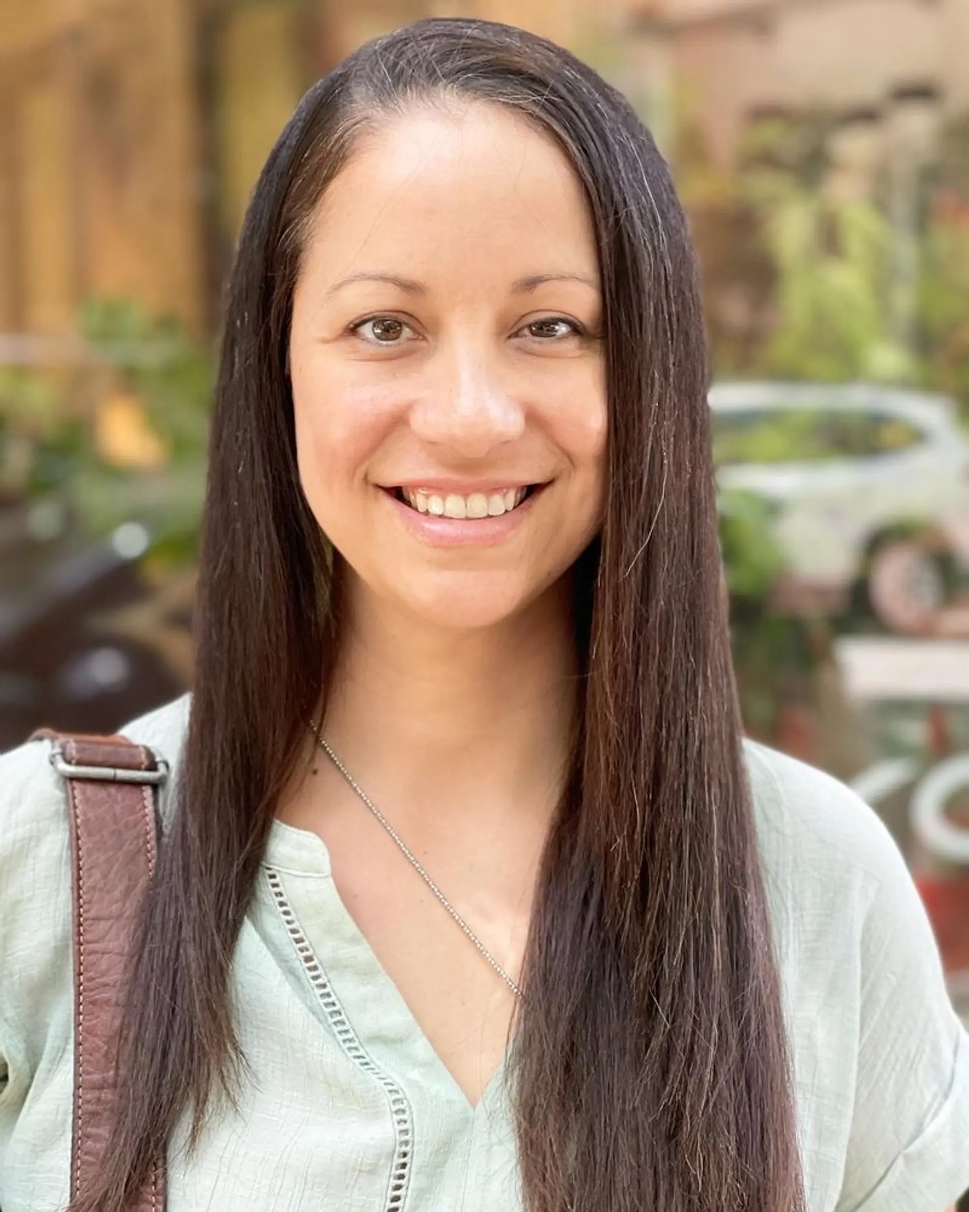 Long, straight brunette hairstyle with a sleek finish. 1