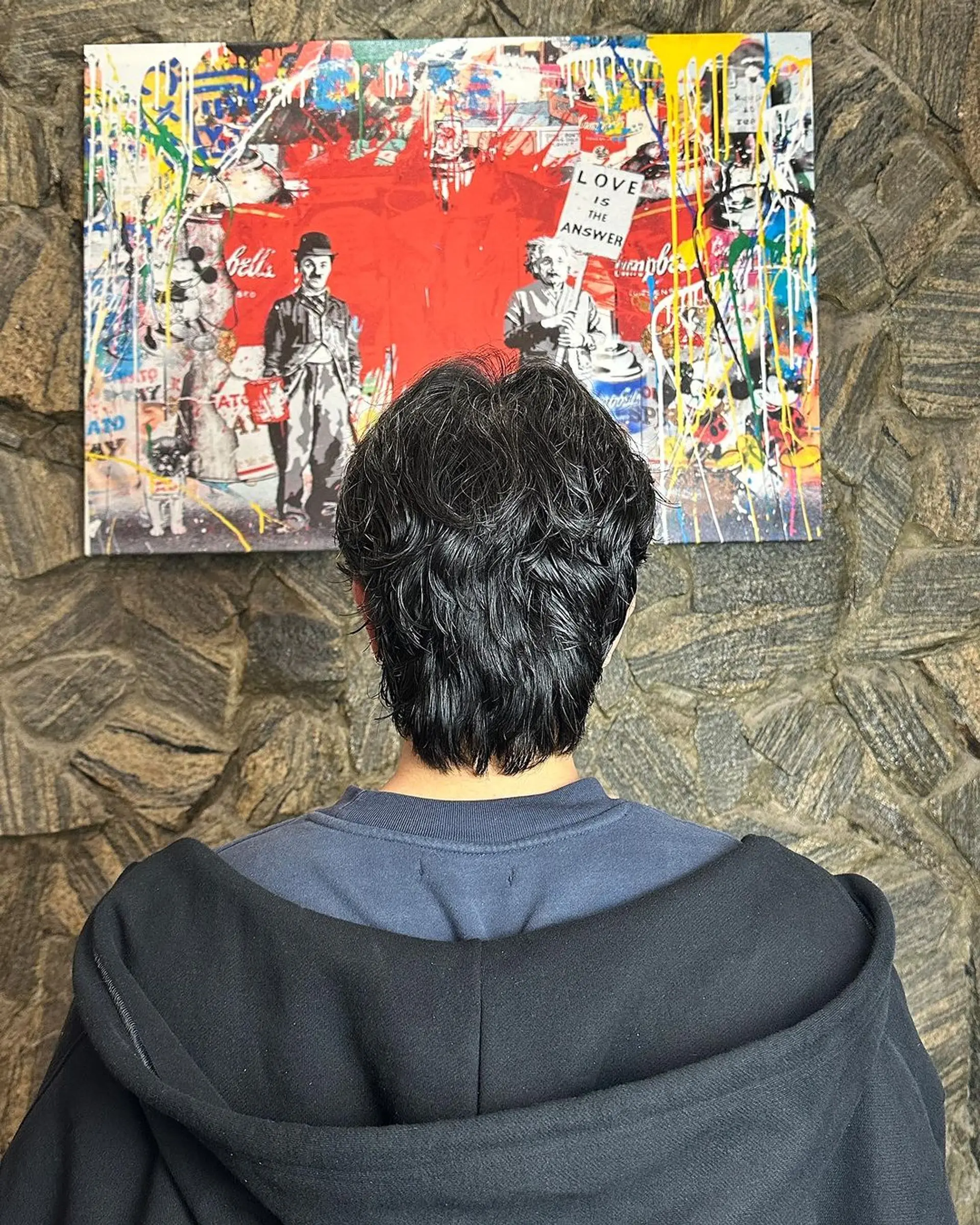 Medium-length, wavy wolf cut with textured layers providing a casual and natural look.  2