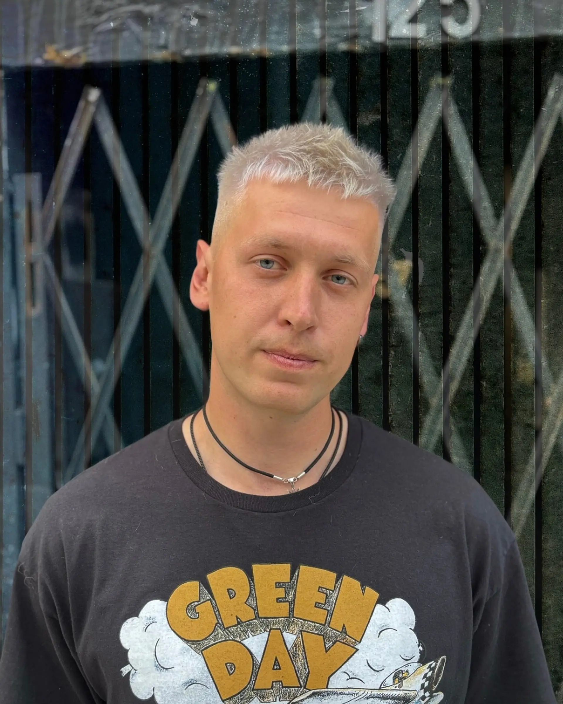 A classic buzz cut dyed platinum blonde. 1