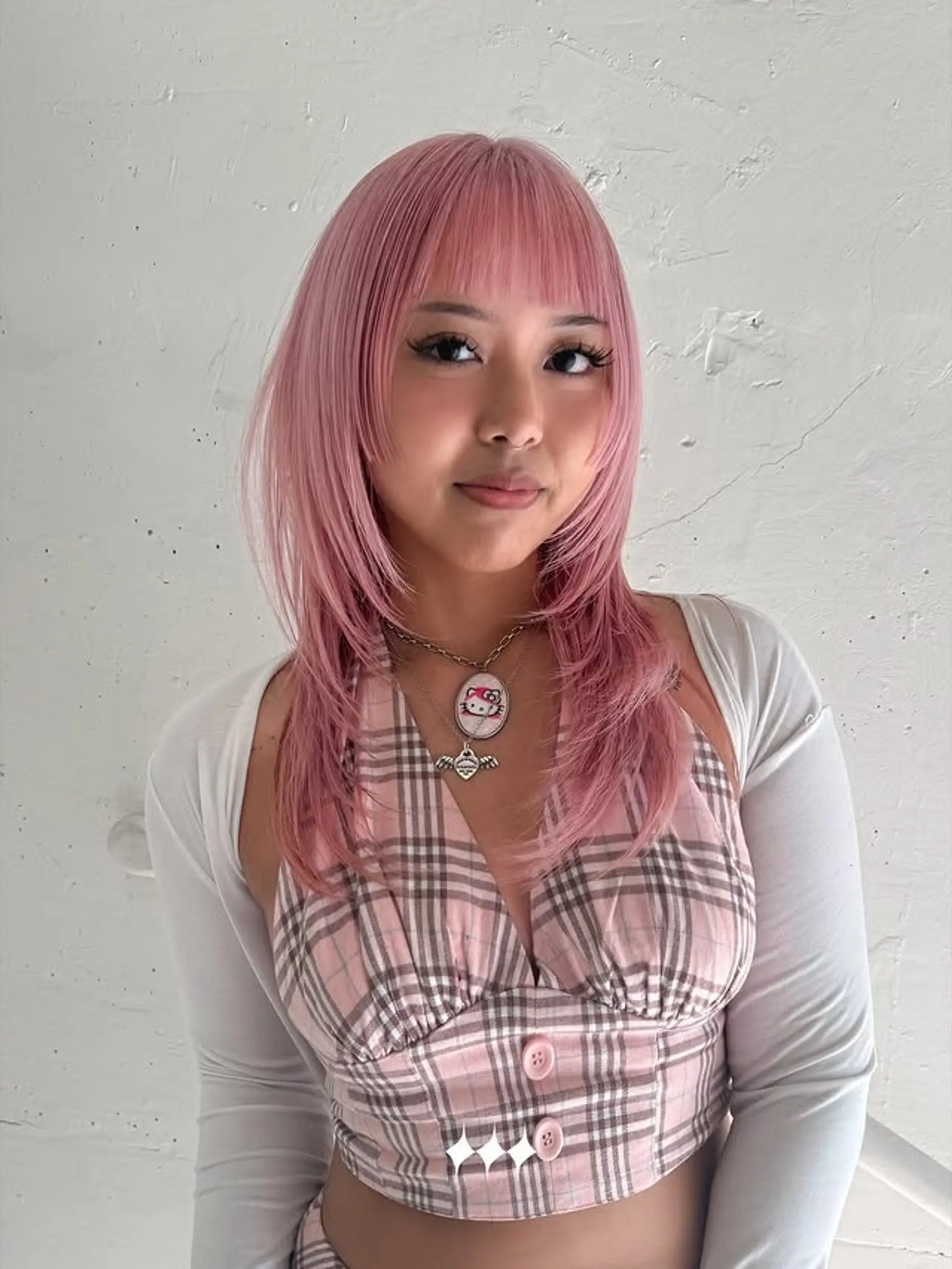 A medium-length shag haircut with blunt bangs and layers. 1