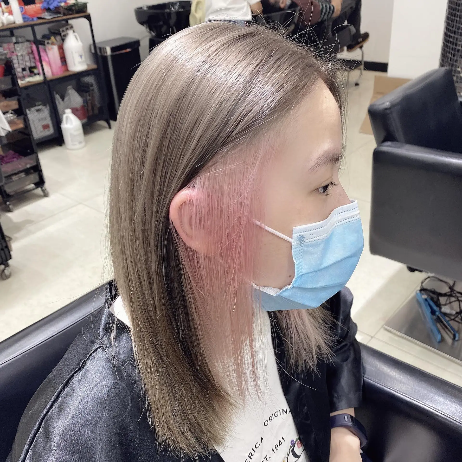 Long, sleek, and silky straight hair in a trendy ash blonde color. 2