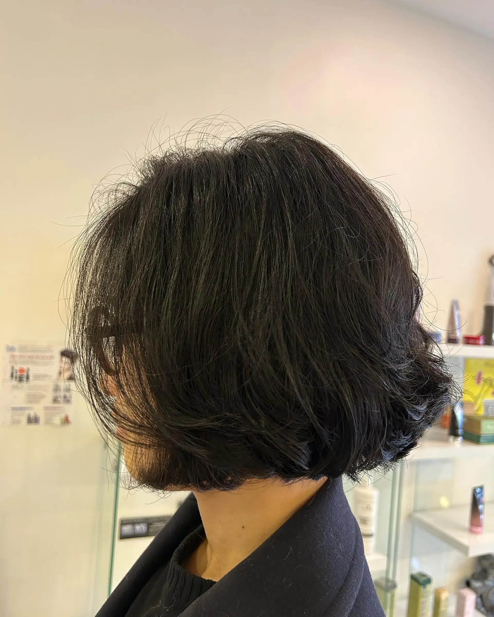 A textured wavy bob with soft body, curved volume, and layered ends. 1