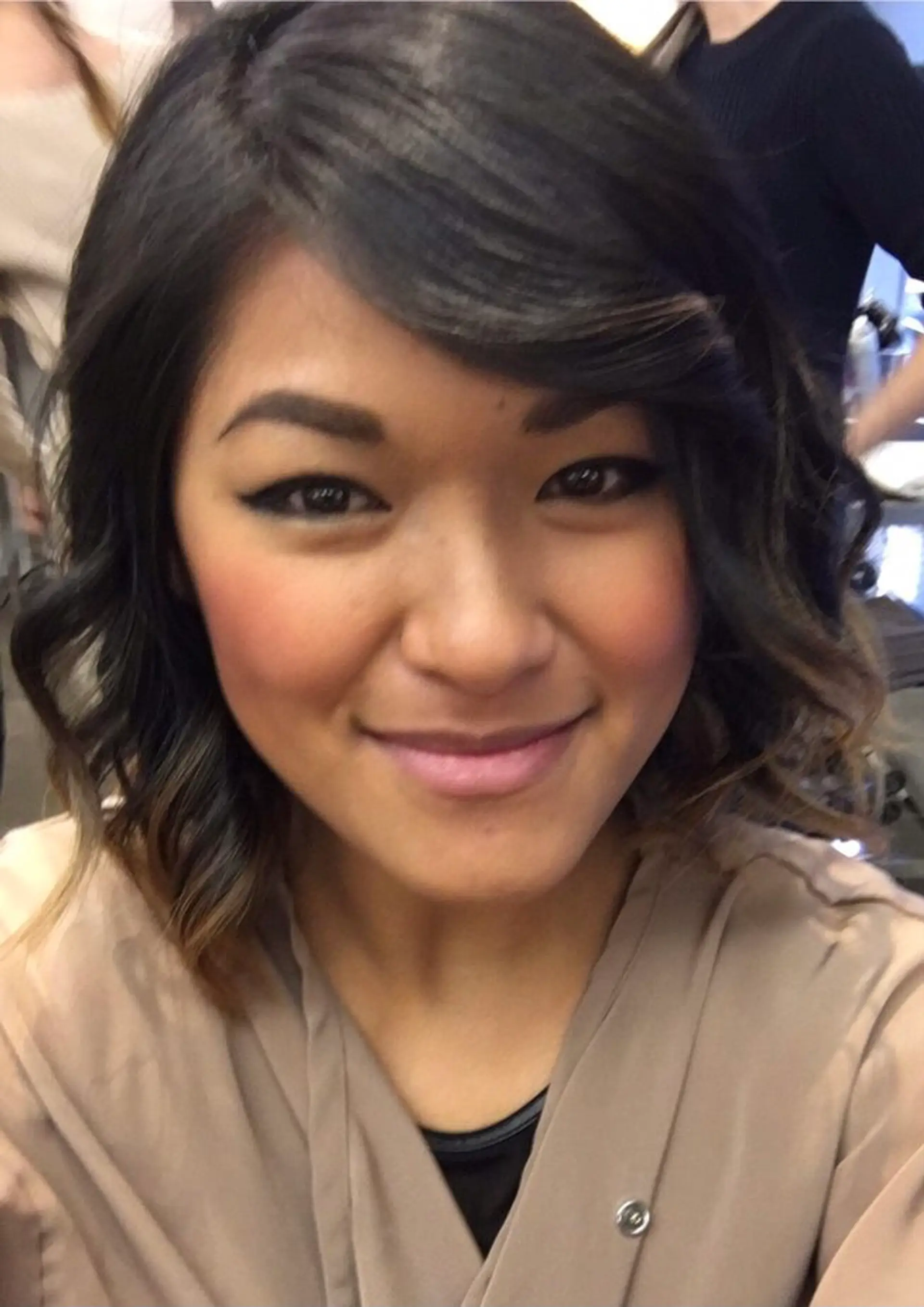 A medium-length wavy bob with soft waves and a side-swept bang. 1