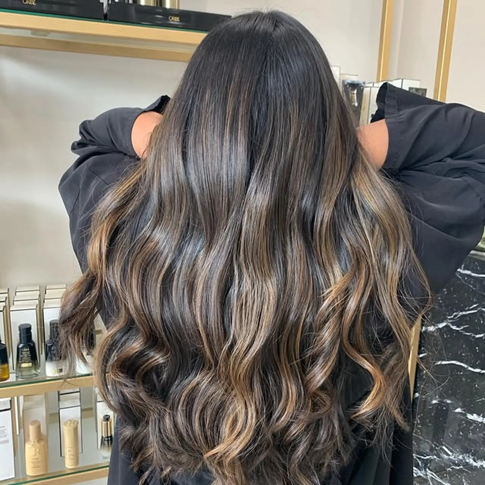 Long, wavy hair with caramel balayage highlights. 1
