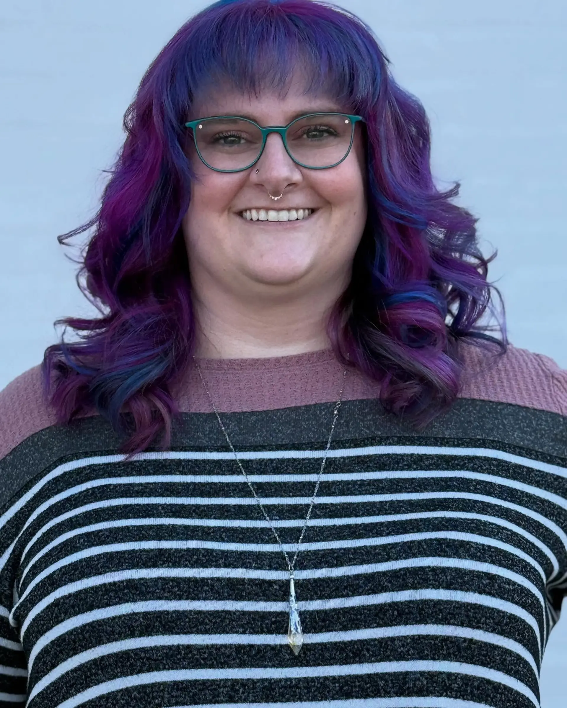Medium-length wavy hair featuring vibrant purple and deep blue mermaid tones with textured bangs. 1