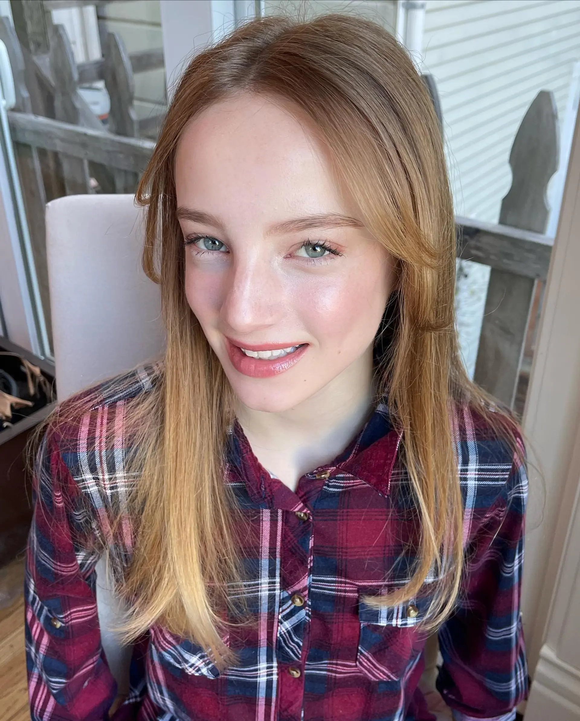 Long straight hair styled with a smooth blowout and soft, cheek-length face-framing layers. 1