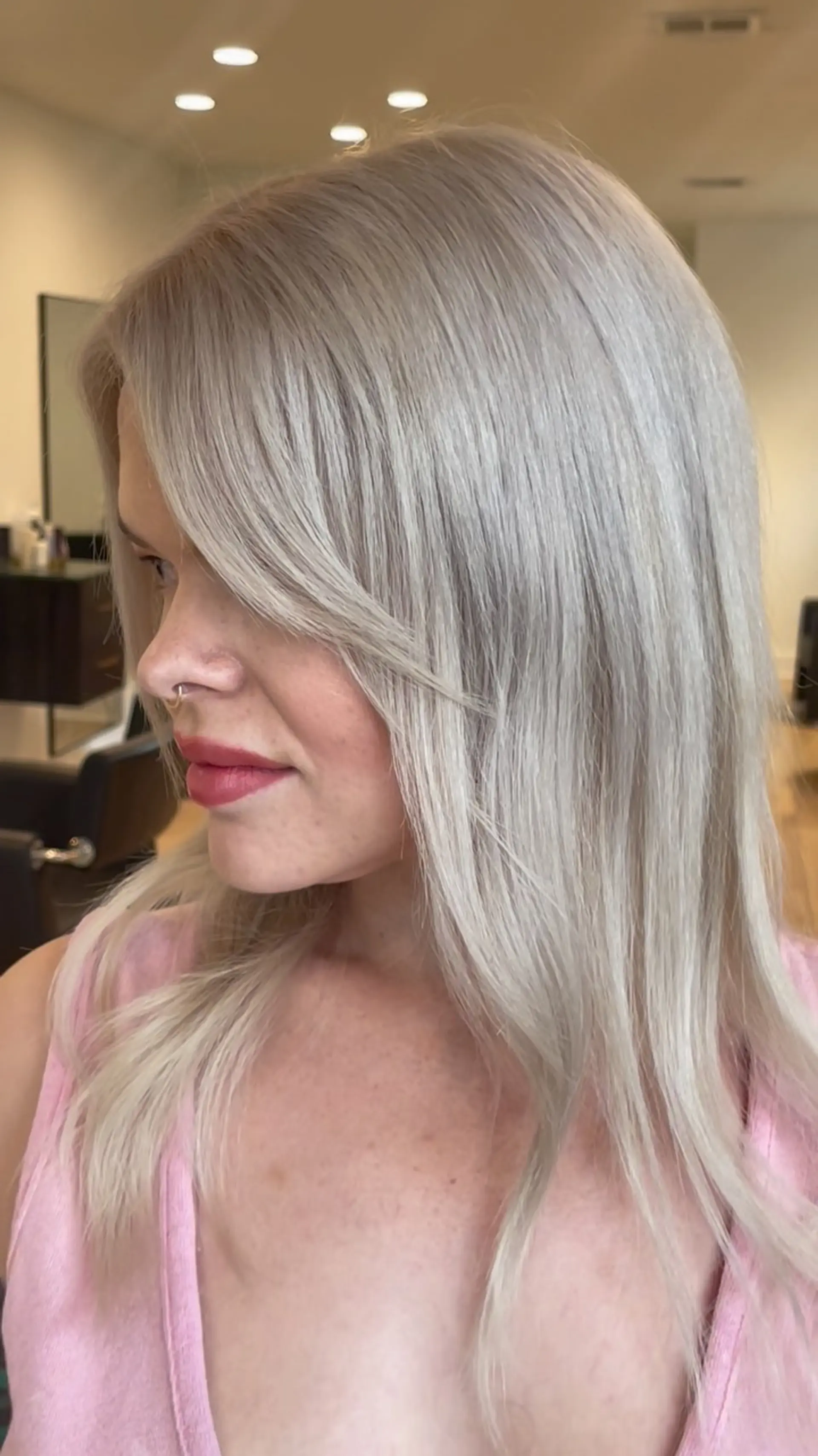 Medium-length straight icy blonde hair styled with side-swept fringe. 1